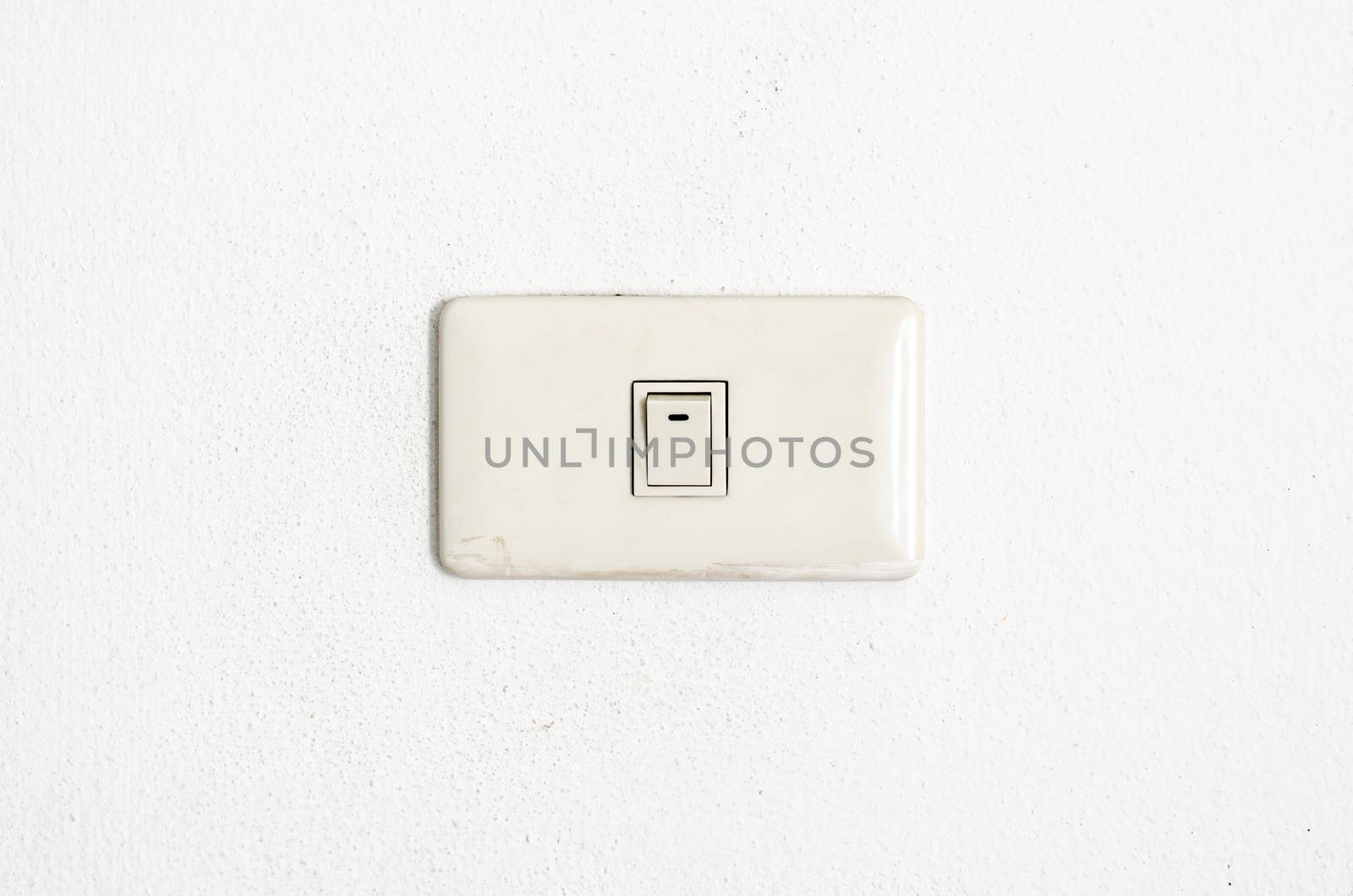 electric white switch on wall