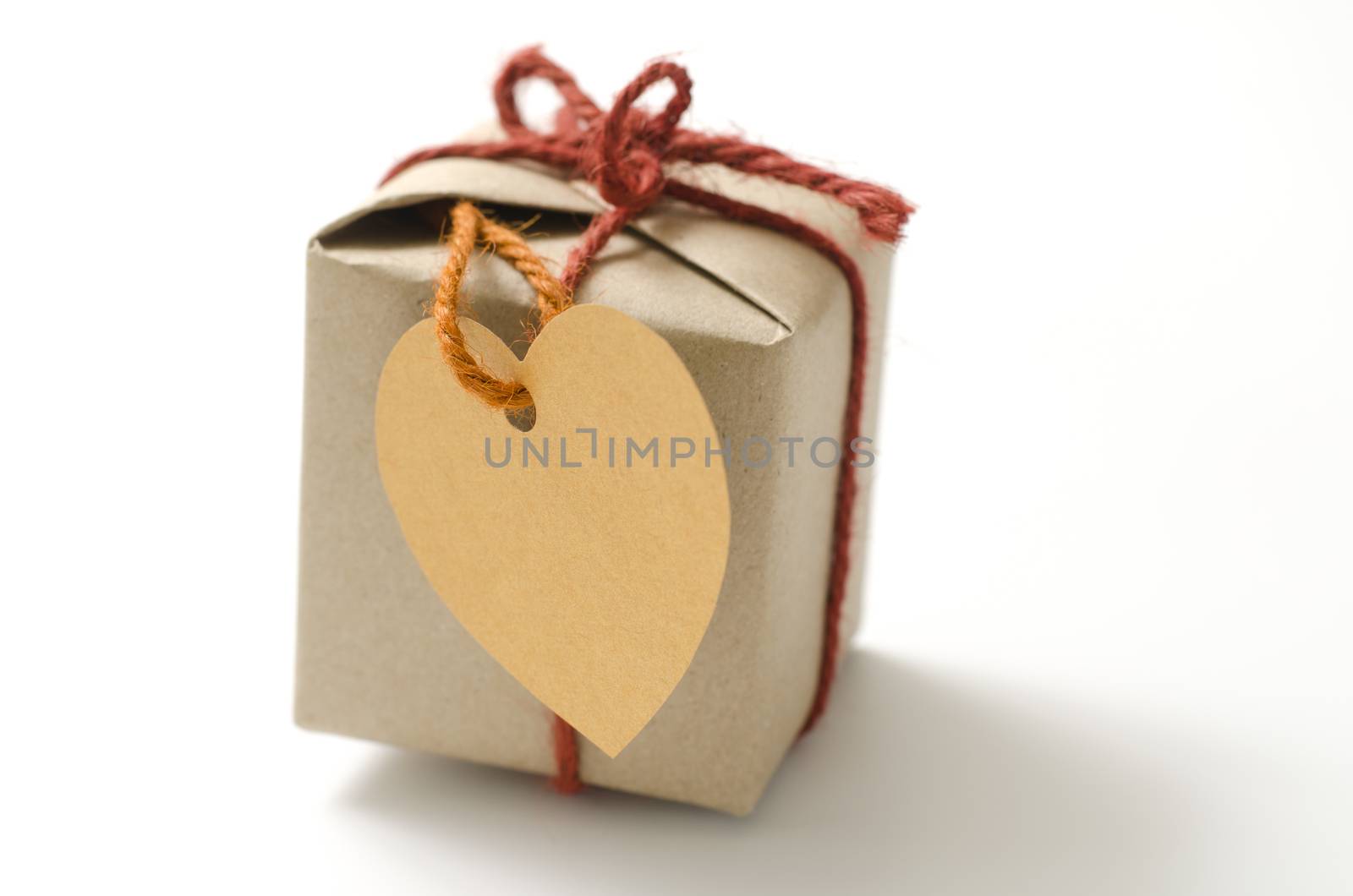 heart tag with single craft cardboard gift box on a white background