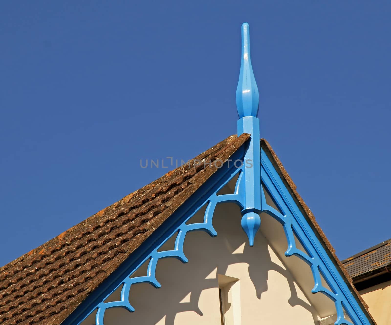 the detail of an ornate roof overhang