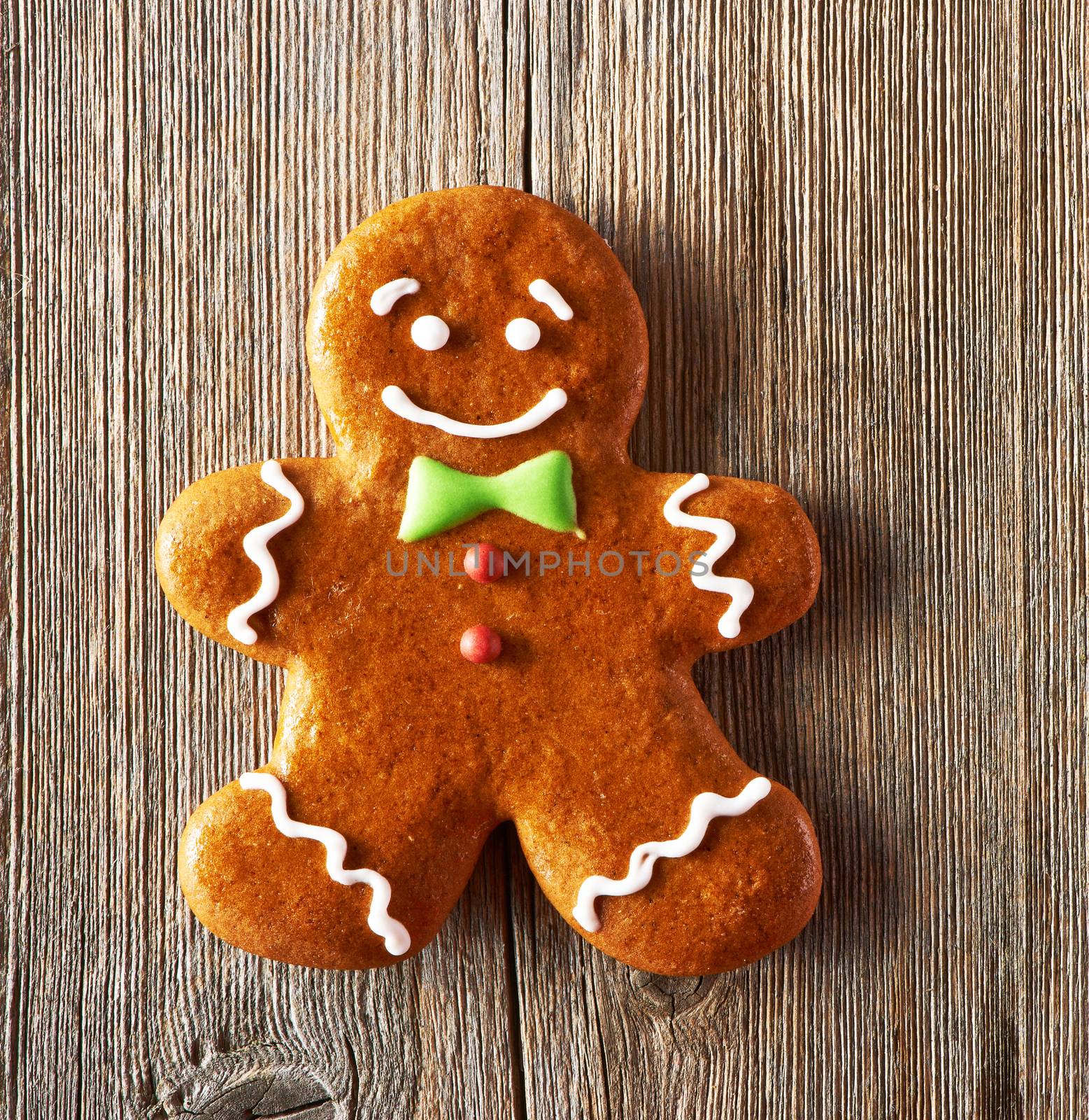 Christmas homemade gingerbread man on wooden table