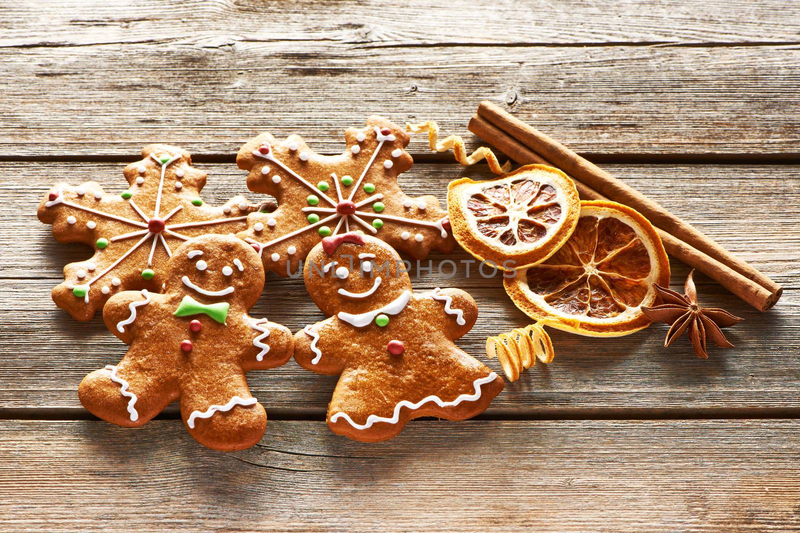 Christmas homemade gingerbread couple cookies on wooden table