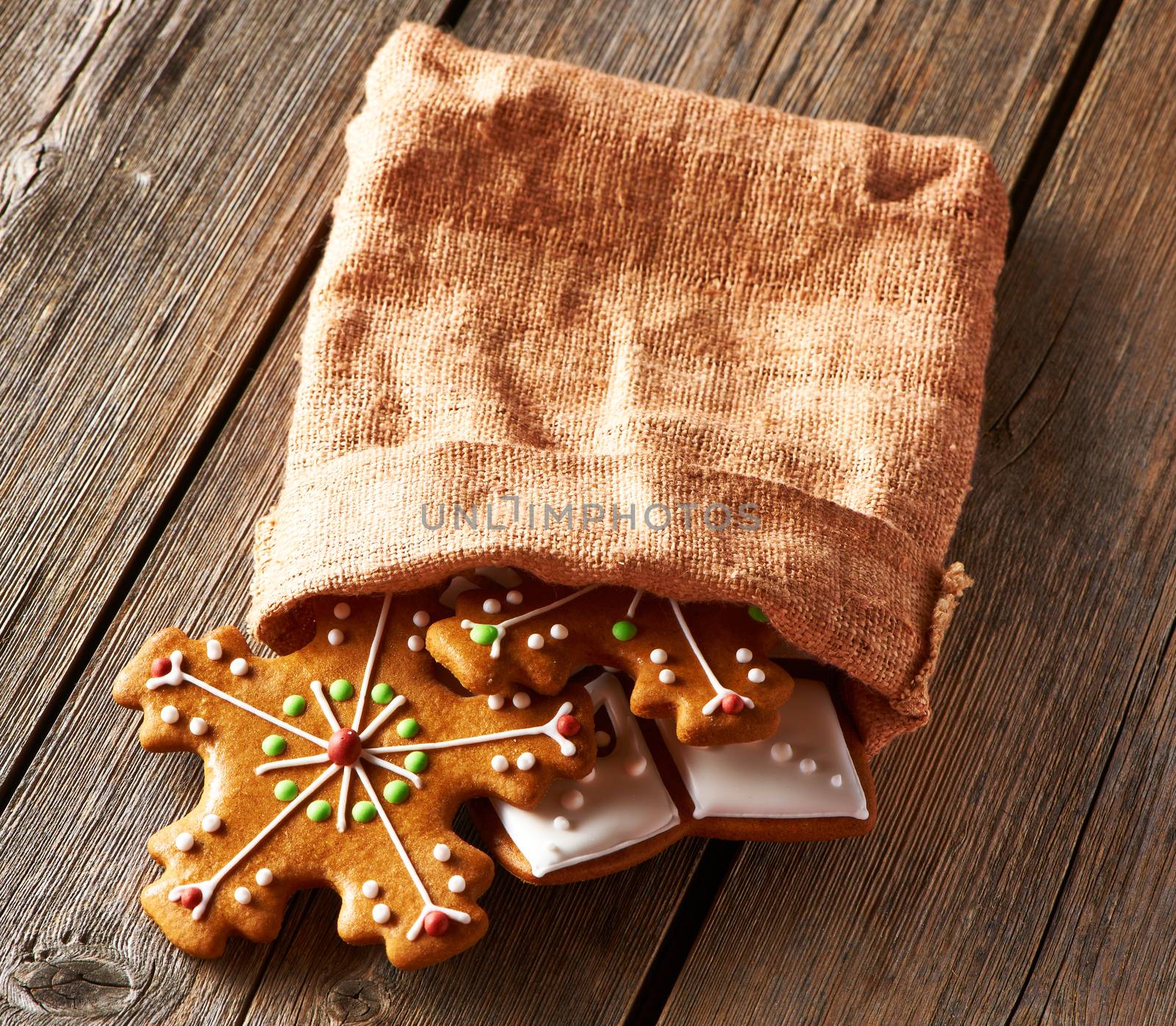 Christmas homemade gingerbread cookies on wooden table