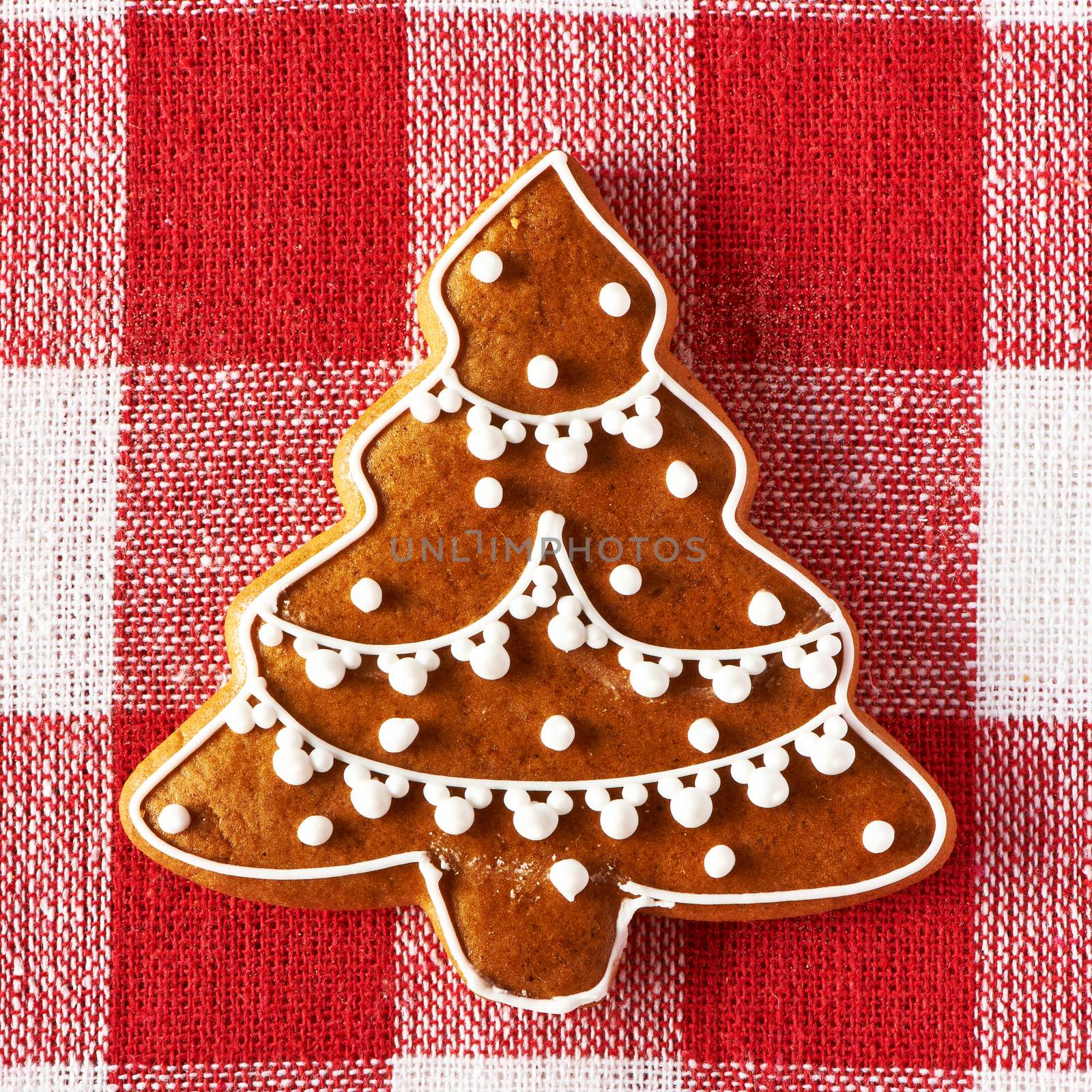 Christmas homemade gingerbread cookie on tablecloth