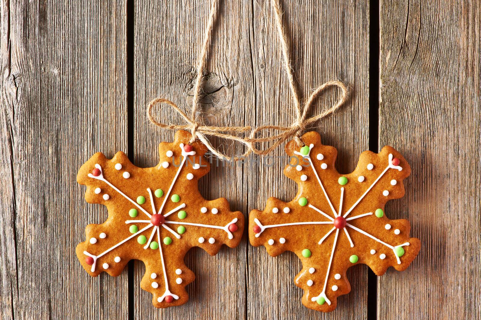 Christmas homemade gingerbread cookies over wooden background