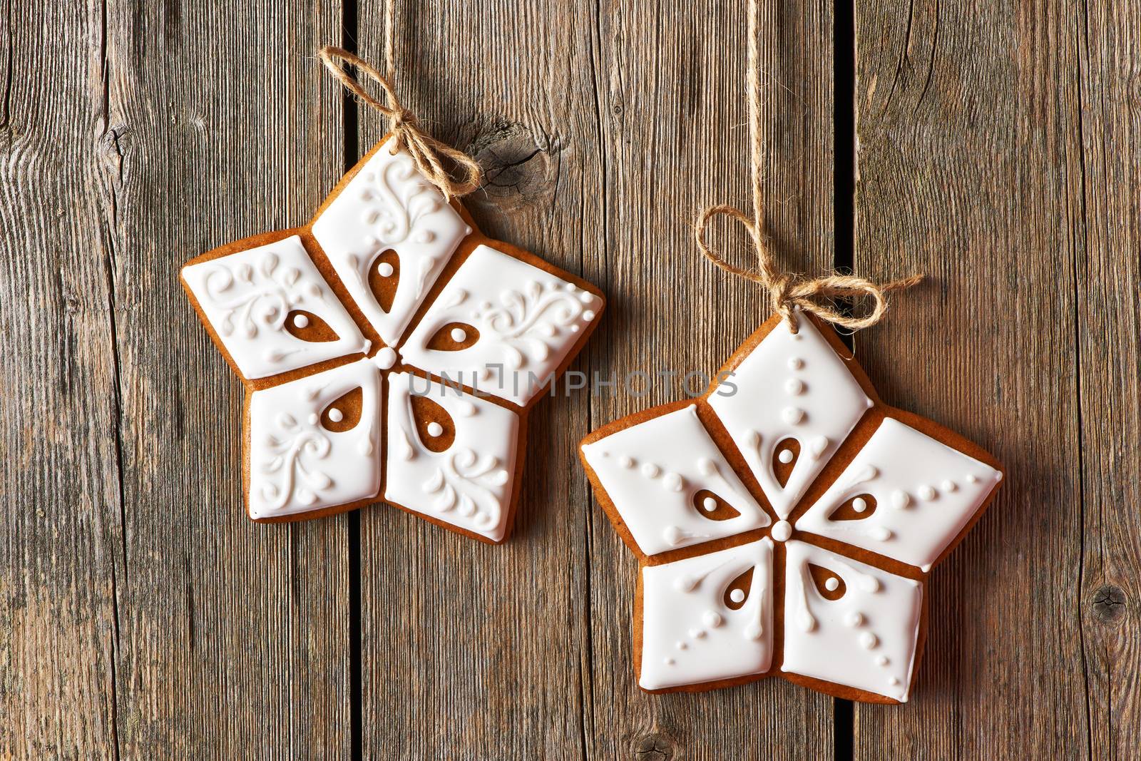 Christmas homemade gingerbread cookies over wooden background