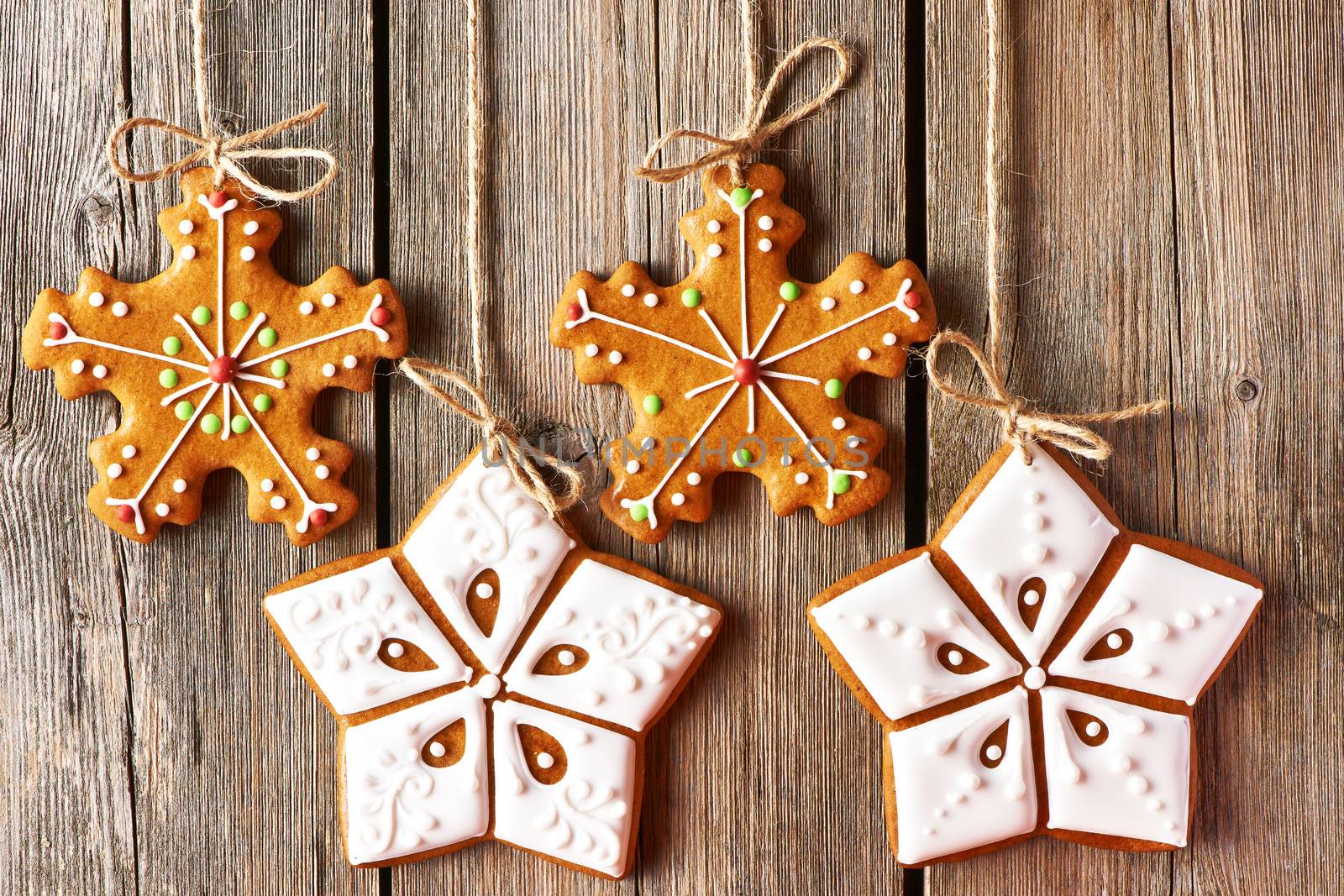 Christmas homemade gingerbread cookies over wooden background