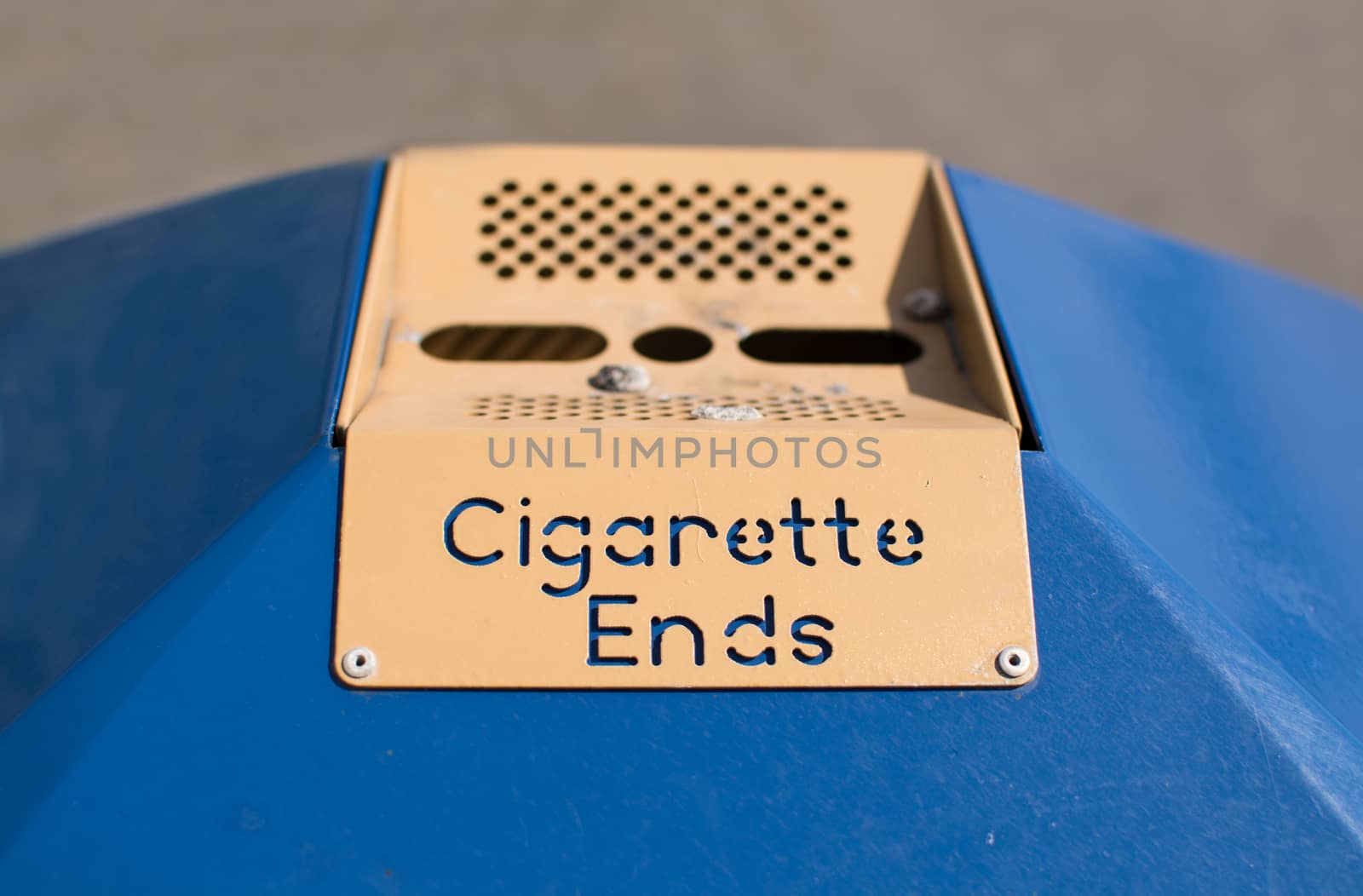 A sign on a public litter bin, with the words Cigarette Ends