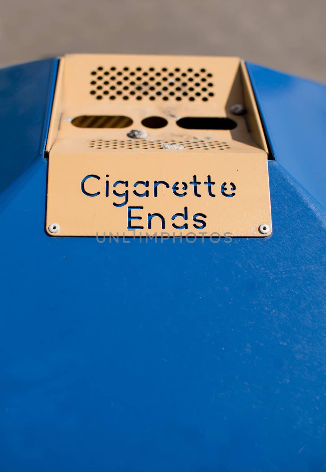 A sign on a public litter bin, with the words Cigarette Ends
