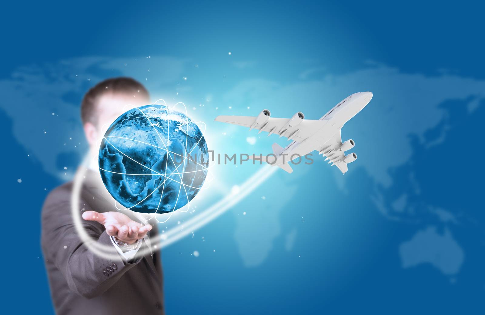Businessman holding earth with airplane by cherezoff