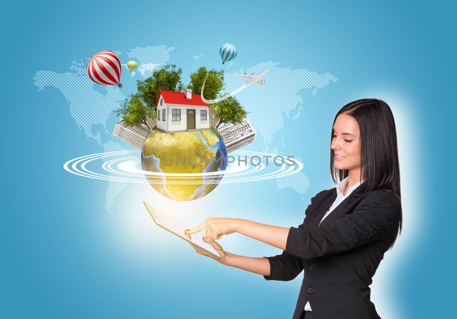 Beautiful businesswomen in suit using digital tablet. Earth with house, buildings, air balloons, trees and airplane. Element of this image furnished by NASA