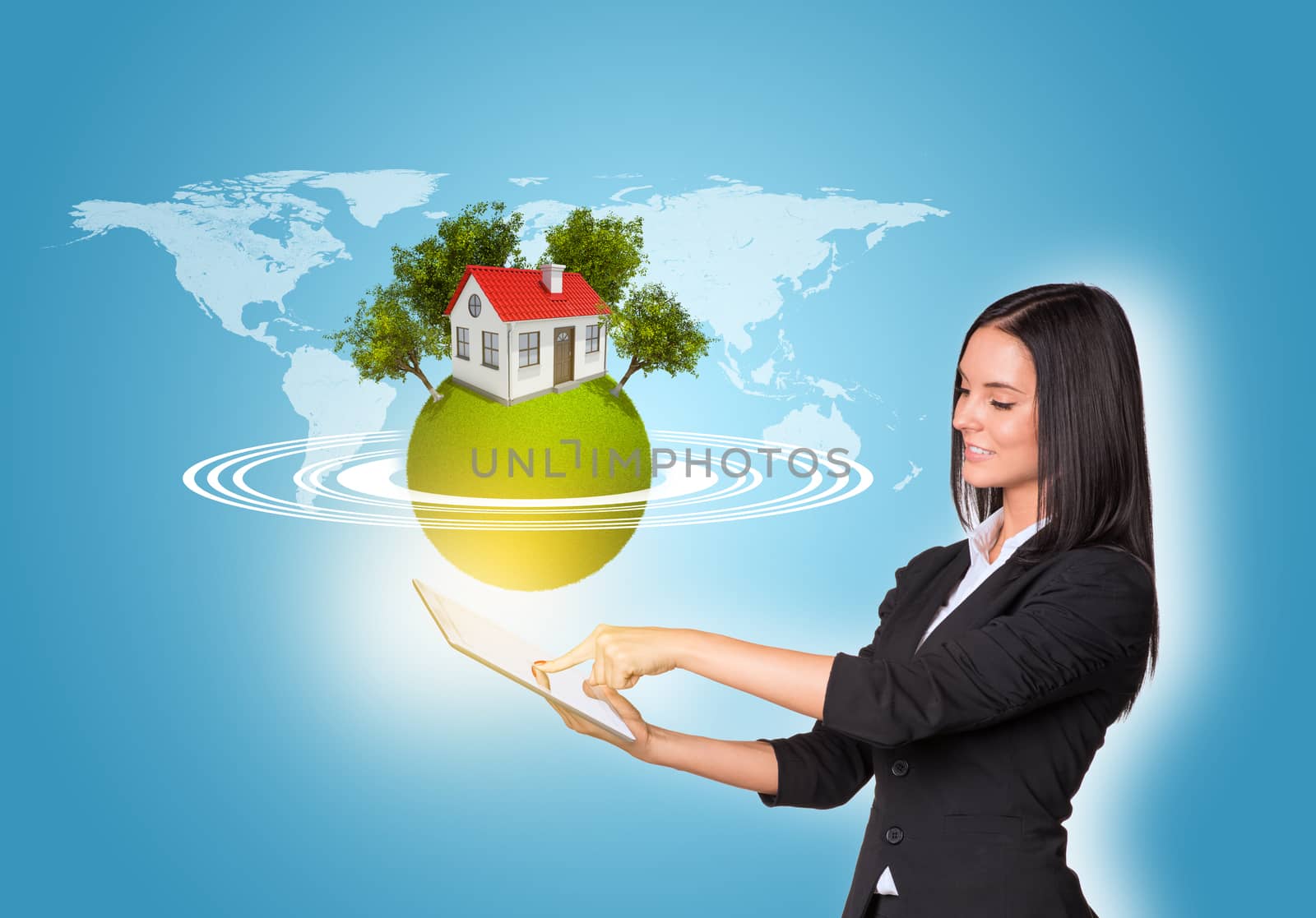 Beautiful businesswomen in suit using digital tablet. Earth with house and trees. World map as backdrop