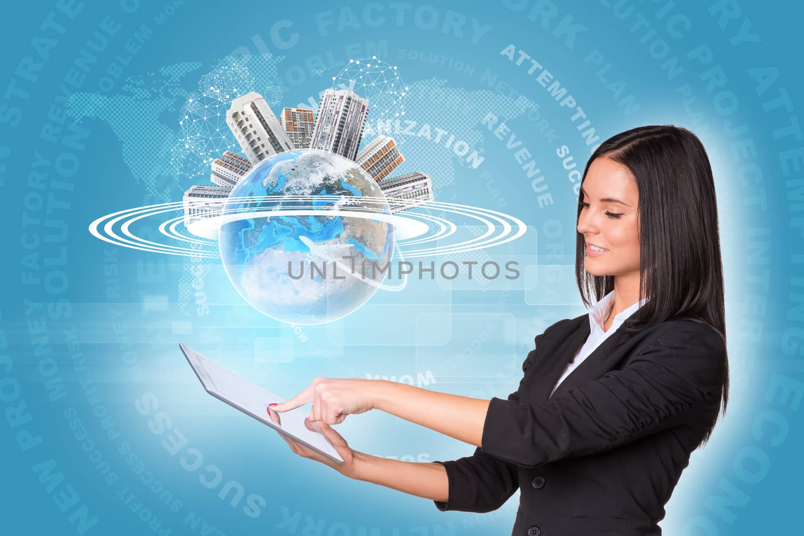 Beautiful businesswomen in suit using digital tabletEarth with buildings and business words. Element of this image furnished by NASA