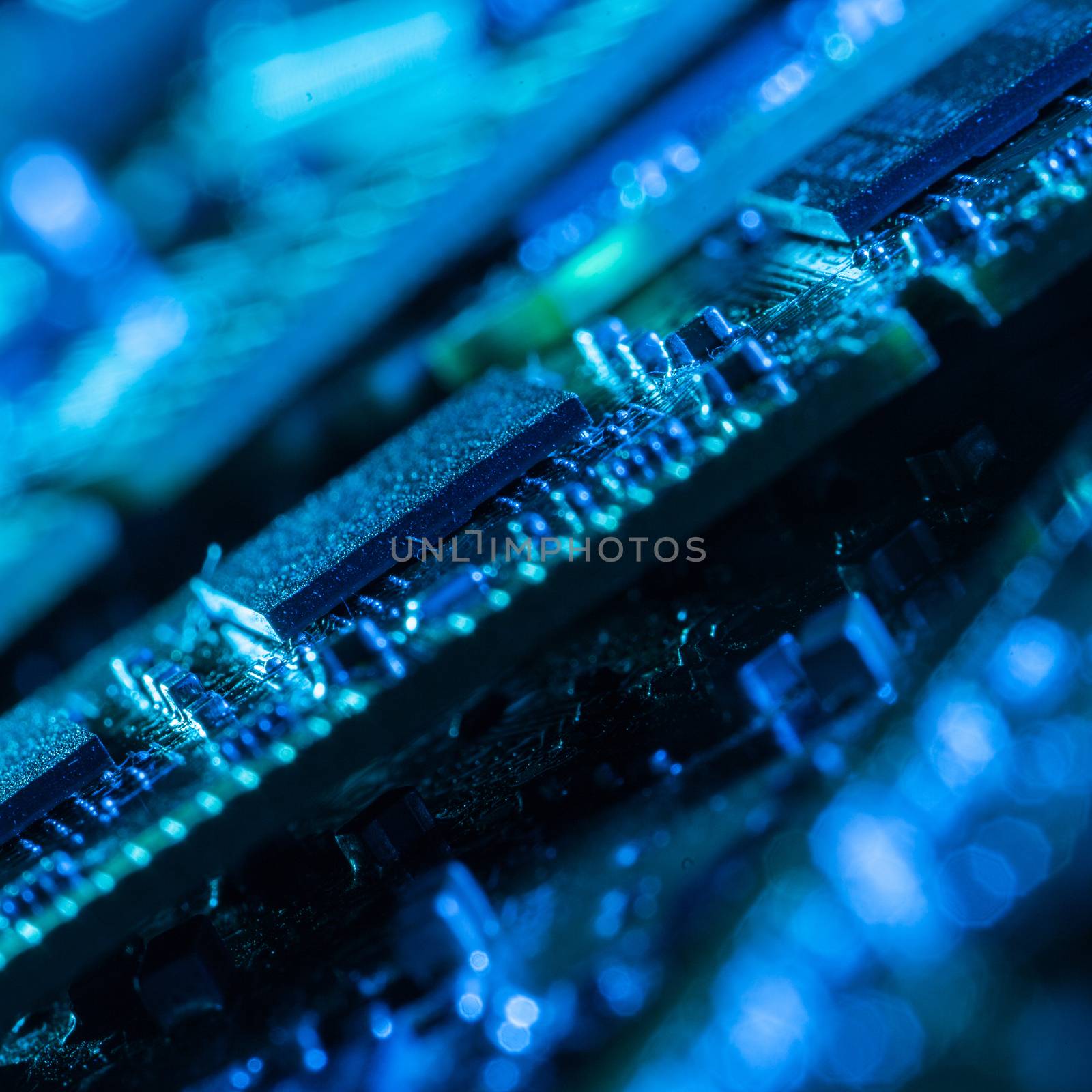 Closeup picture of some computer parts in blue light