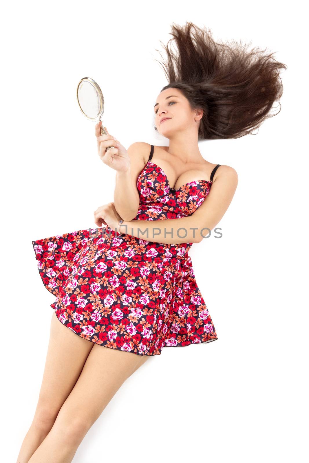high angle view of a woman in summer dress with hand mirror - isolated on white