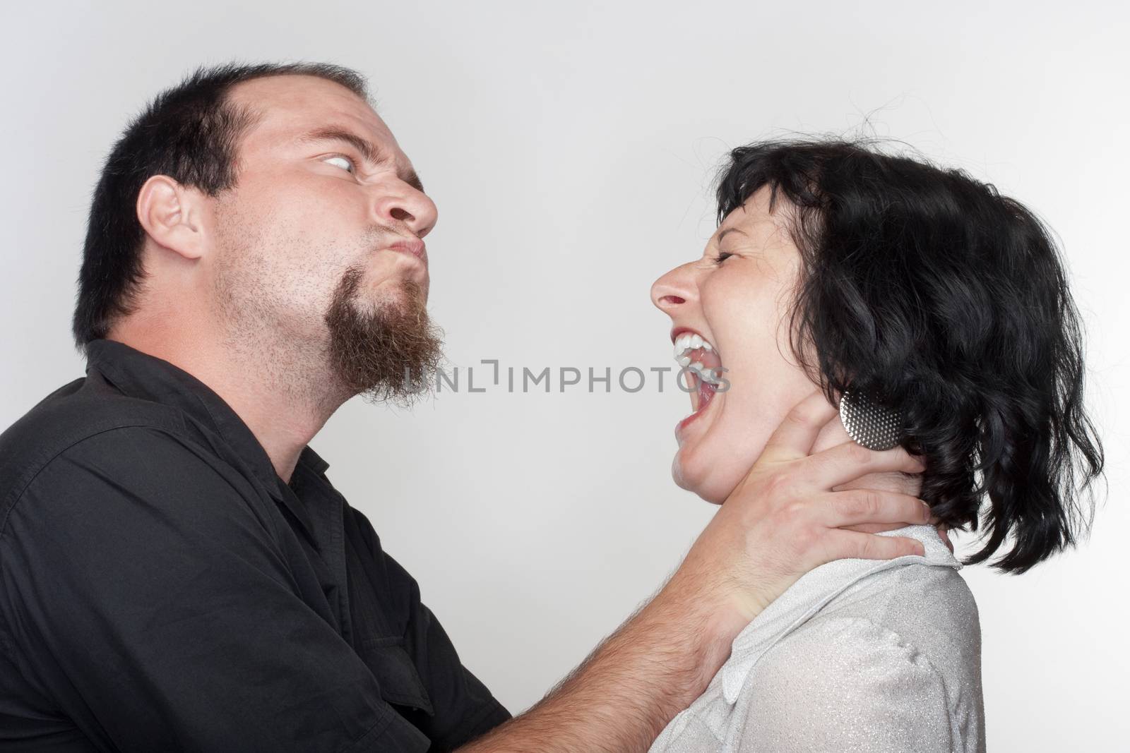 couple fighting, man abusing the woman - isolated on white