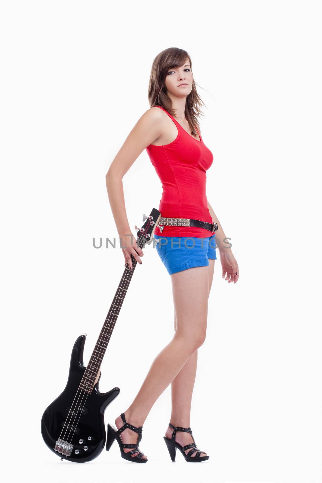 young female bass guitar player in red top - isolated on white