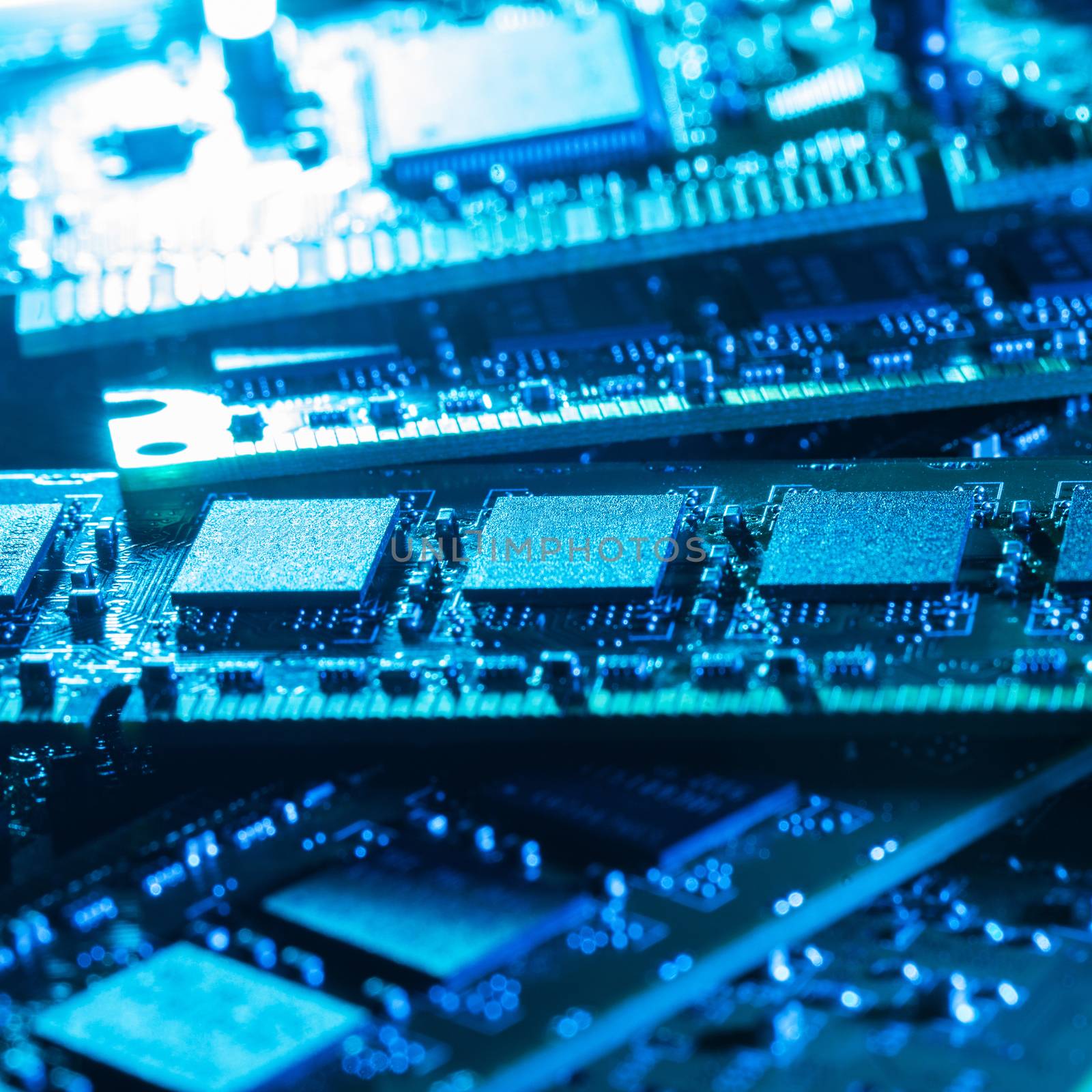 Closeup picture of some computer parts in blue light