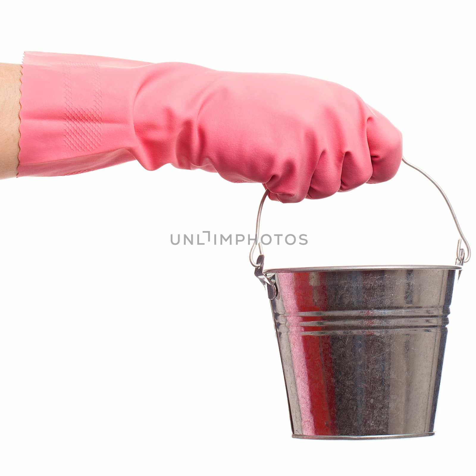 Hand in a pink domestic glove holding silver pail isolated over white background
