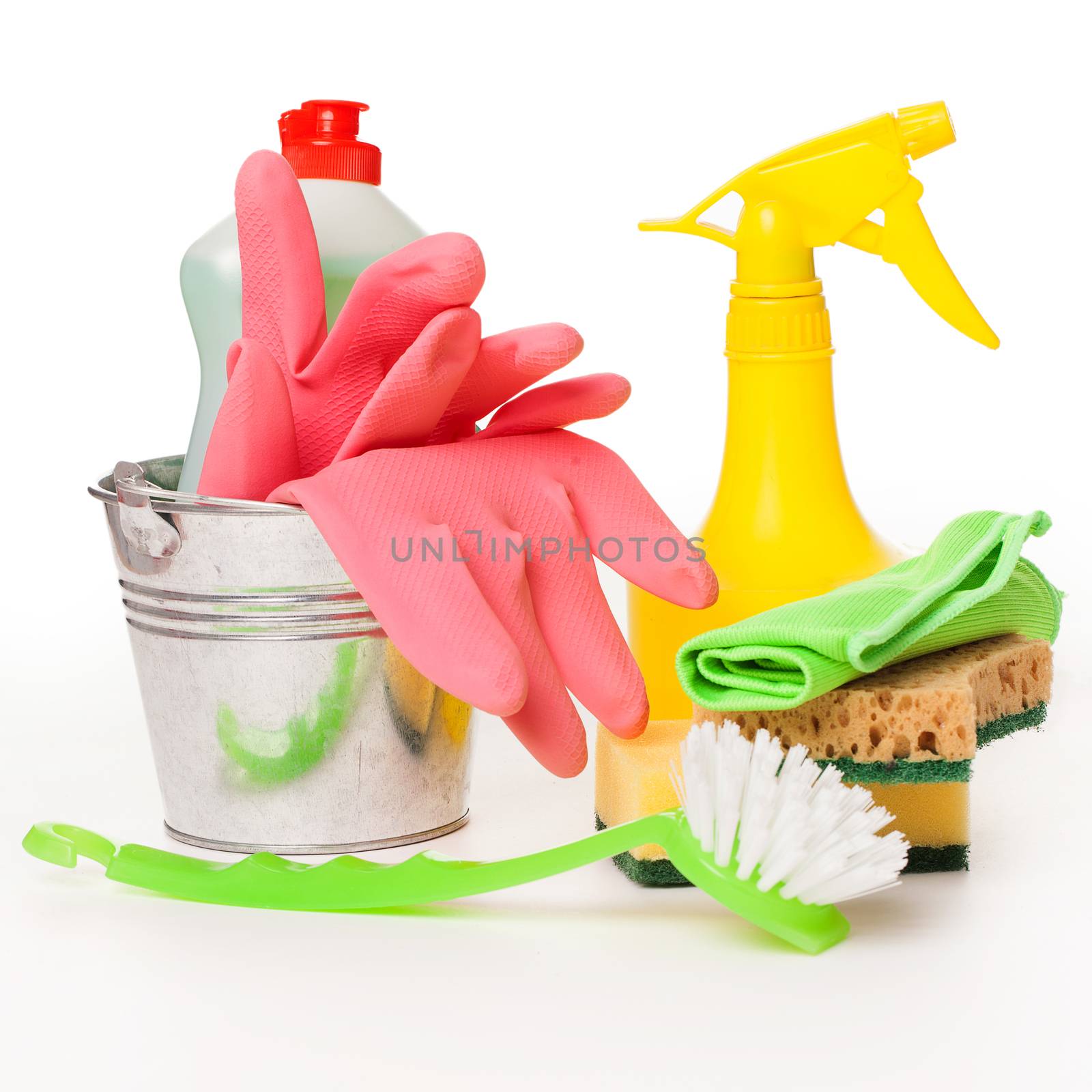Bright colorful cleaning set on a wooden table by rufatjumali