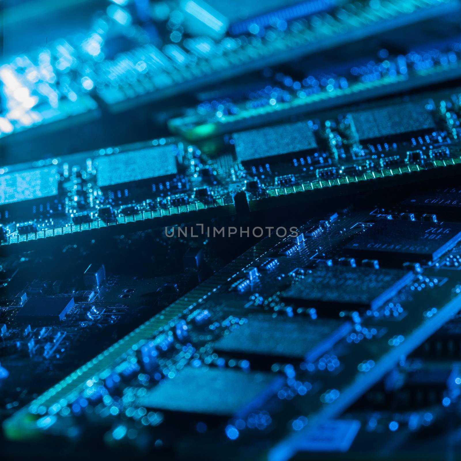 Closeup picture of some computer parts in blue light