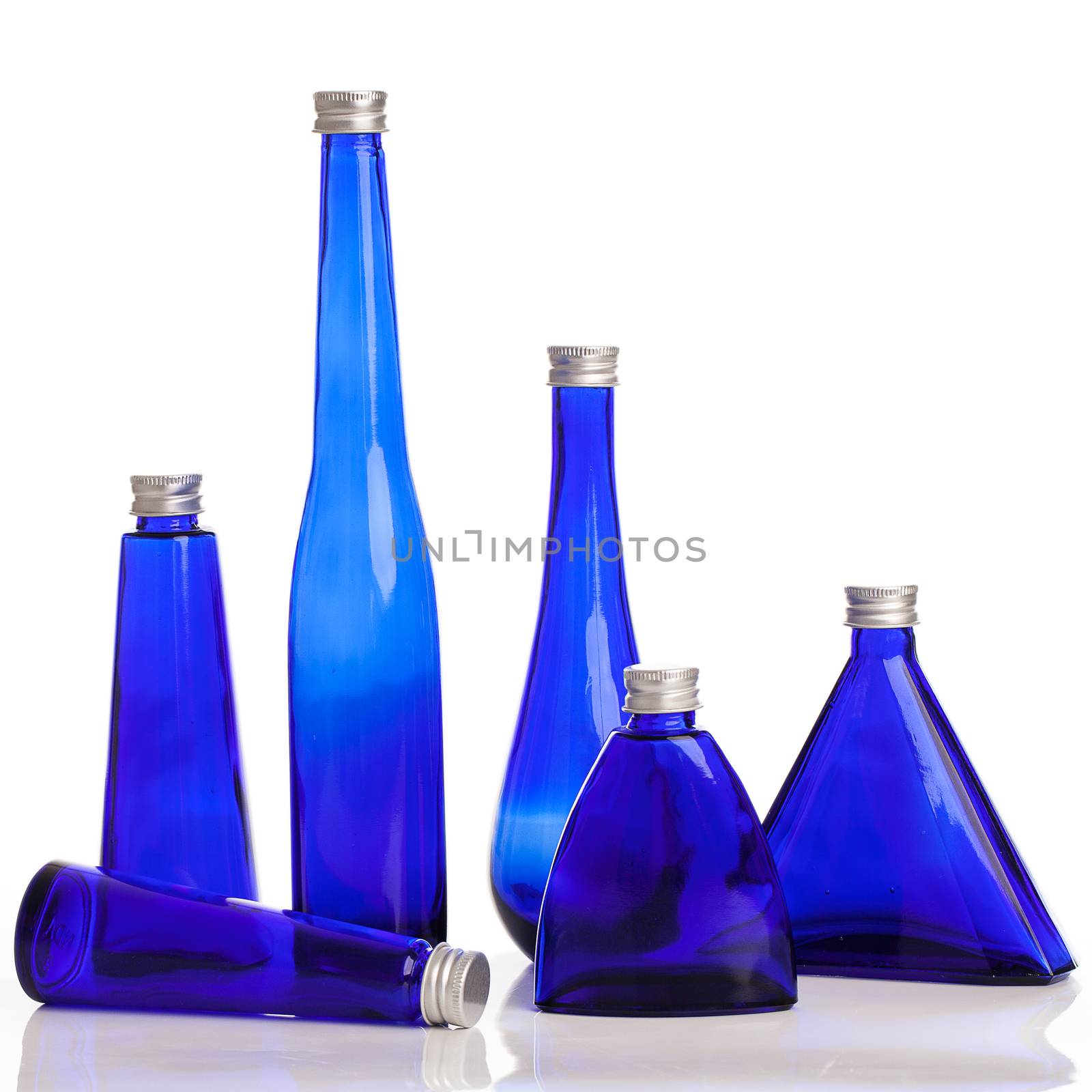 Little blue bottles isolated over white background