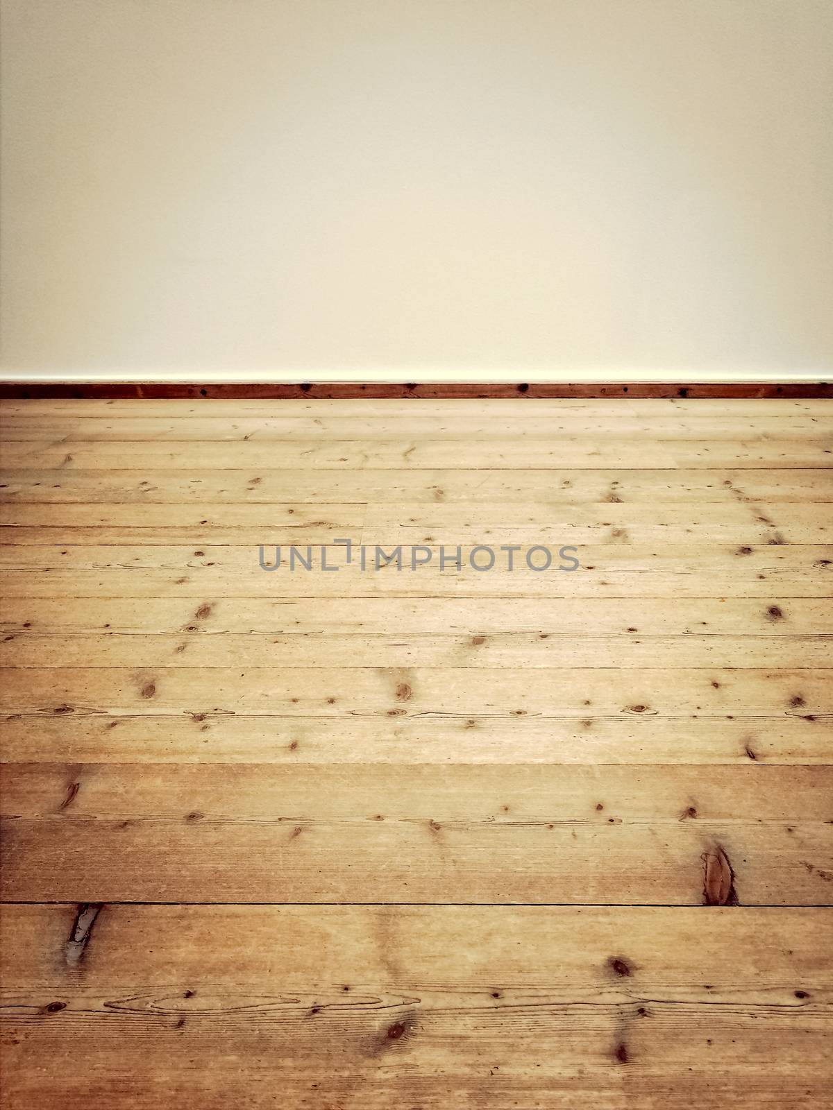 Interior of an empty vintage room with wooden floor.