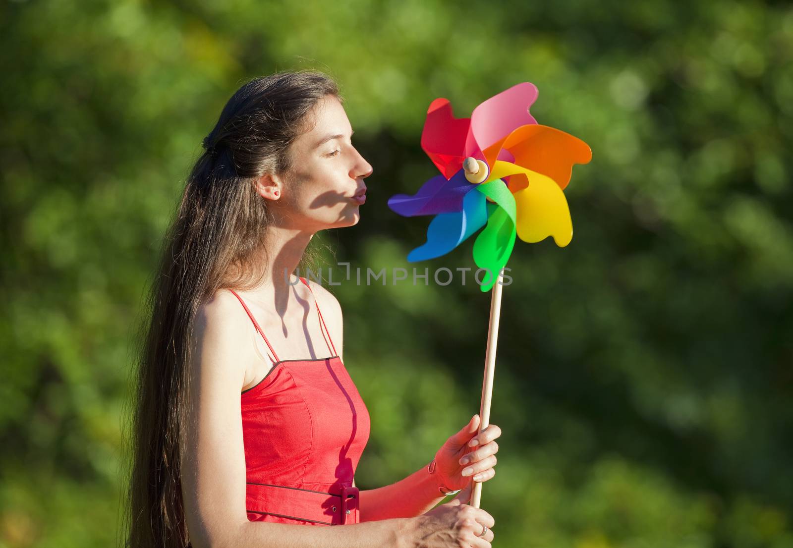 woman with pinwheel by courtyardpix
