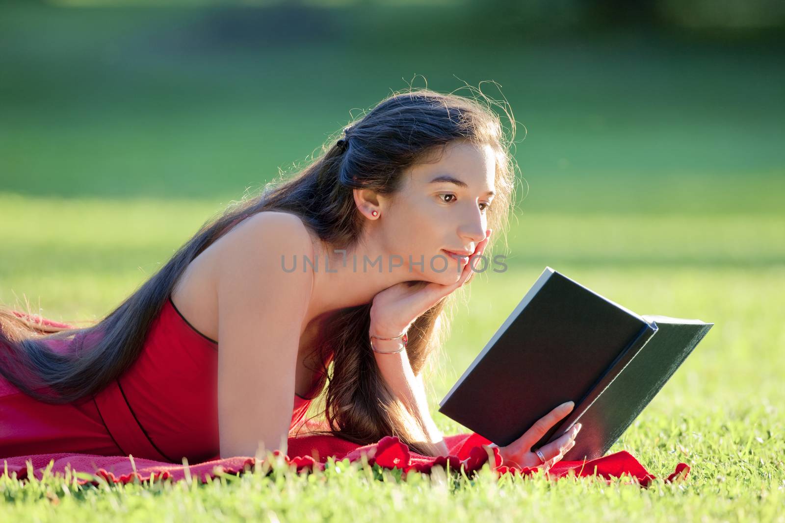 woman reading a book by courtyardpix
