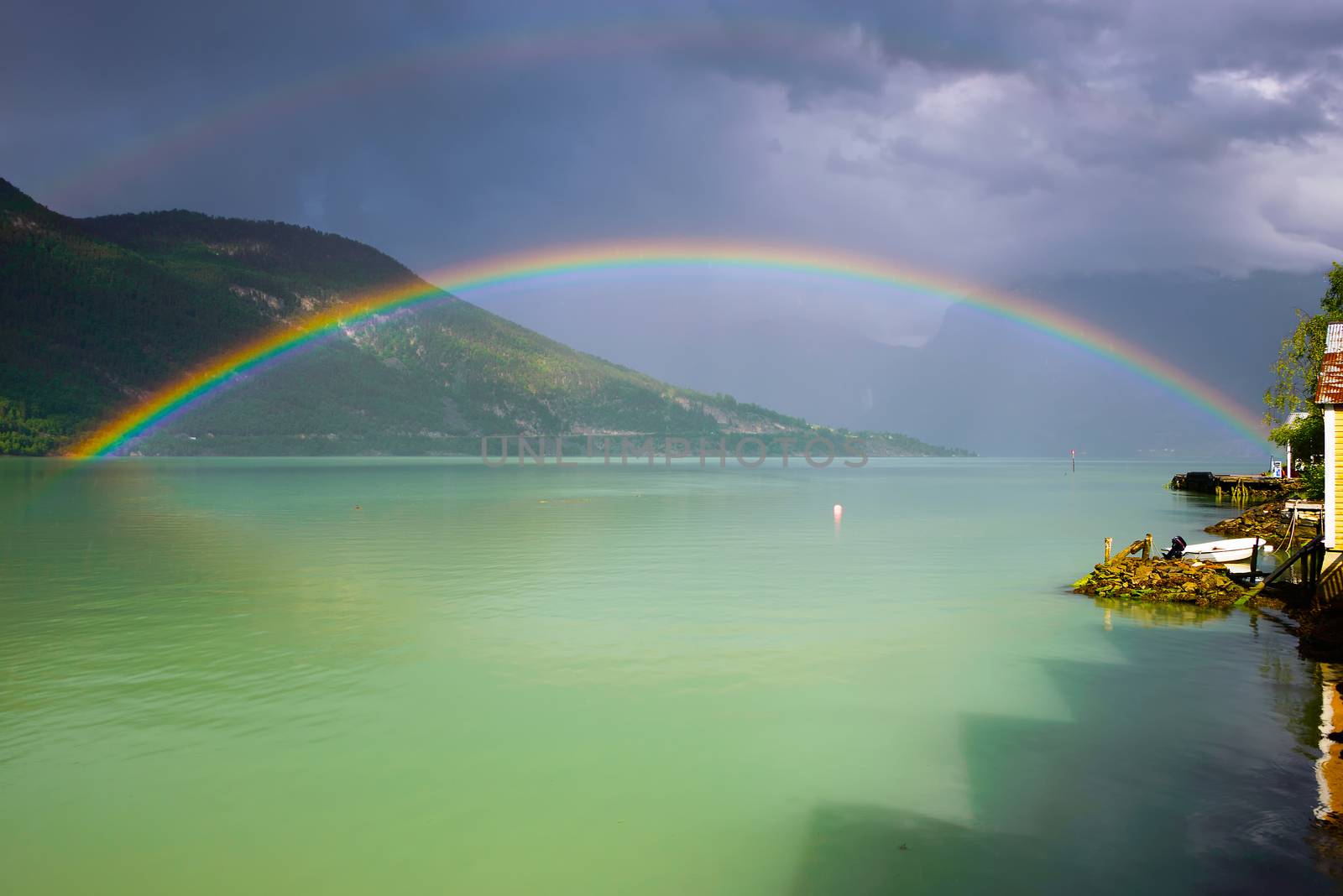 Full, double rainbow over the Lustrafjord, an arm of the Sognefjord in Sogn og Fjordane, Norway.