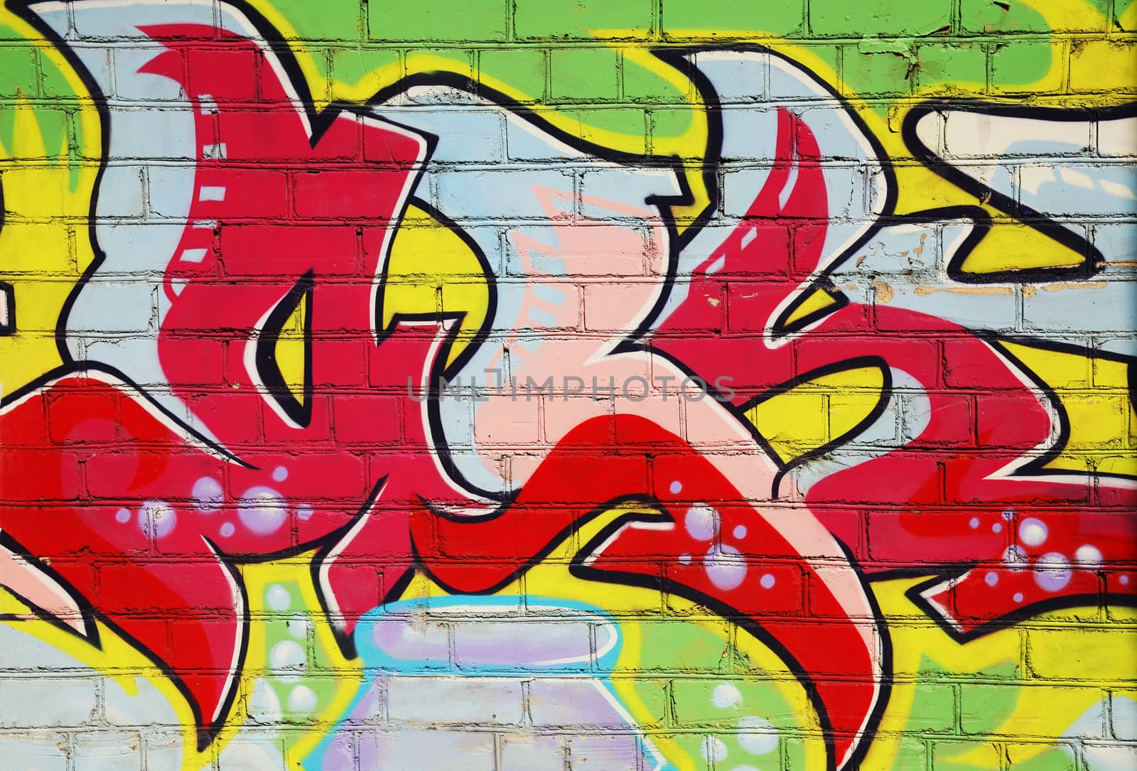 graffiti colour drawing on brick wall
