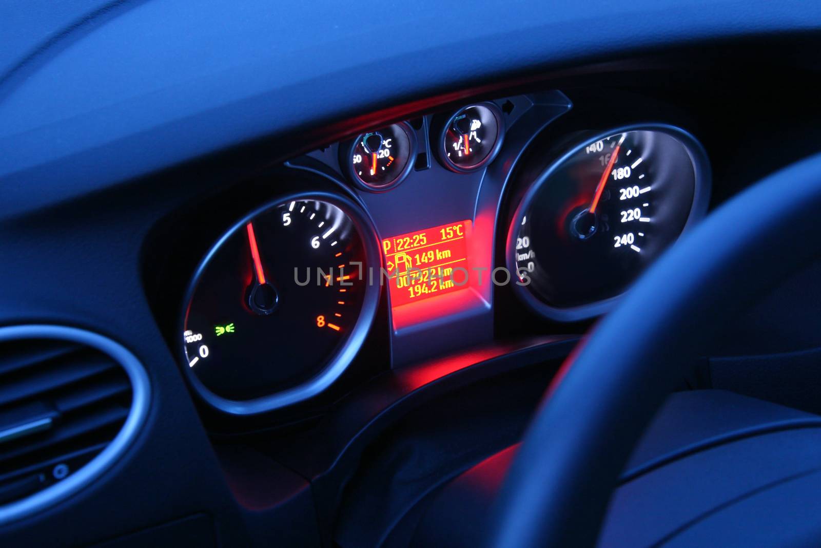  panel of devices of the car rushing by night