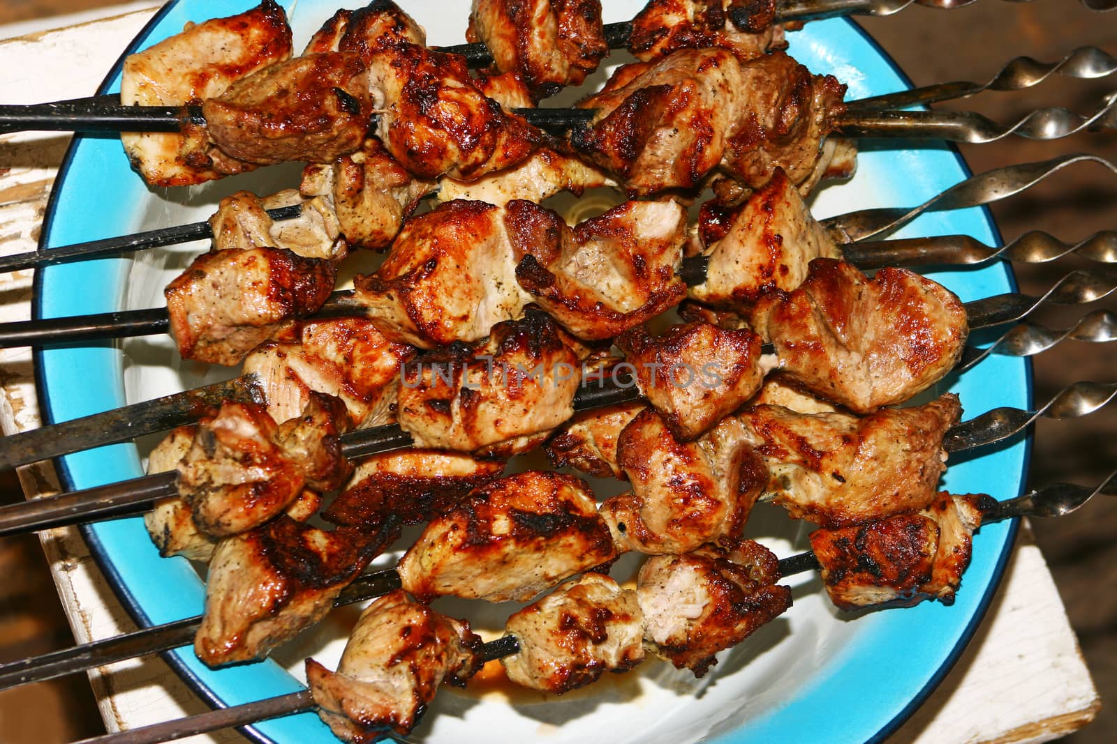 Shish kebab from pork on skewers outside