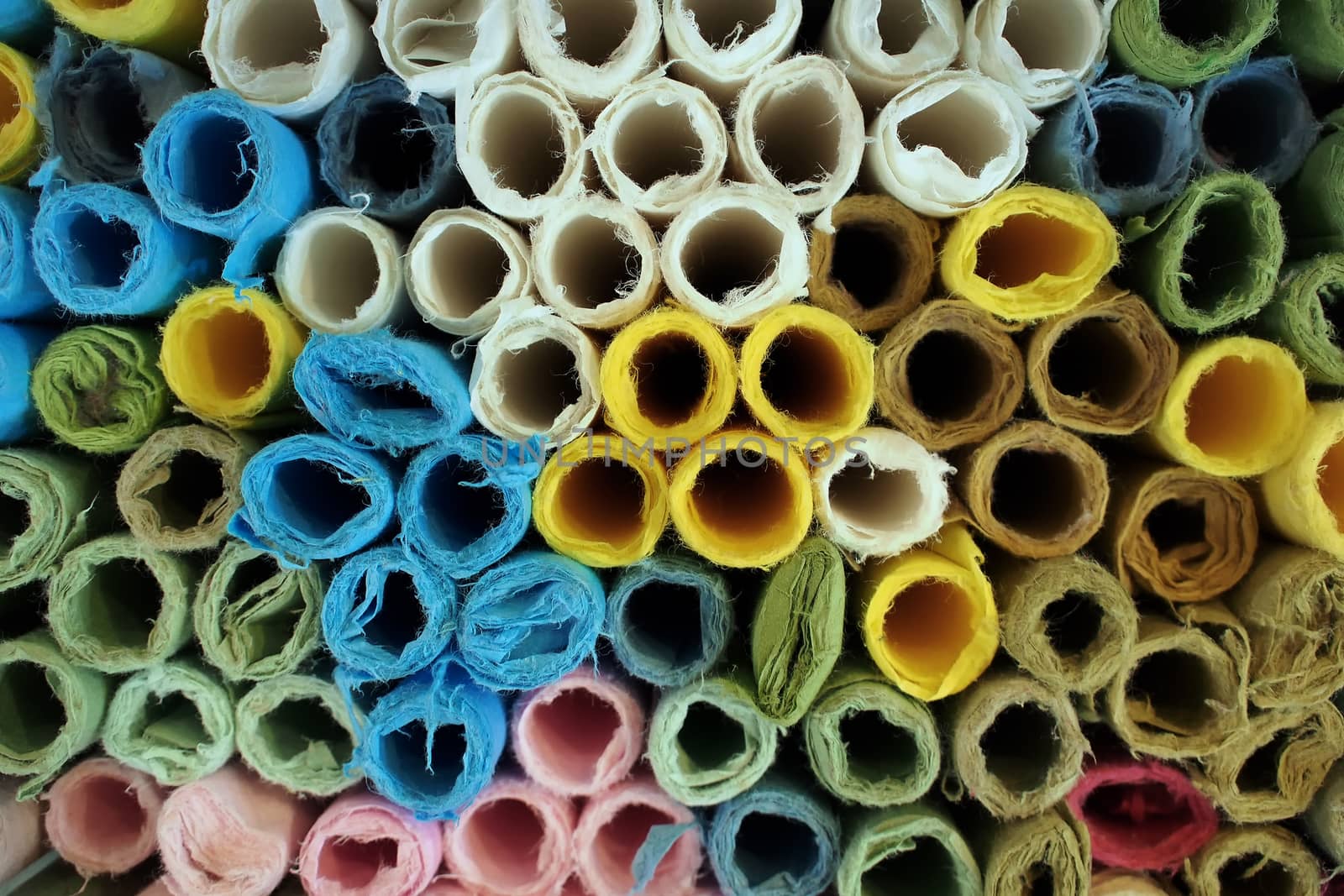 rolls of colorful wrapping paper as background   