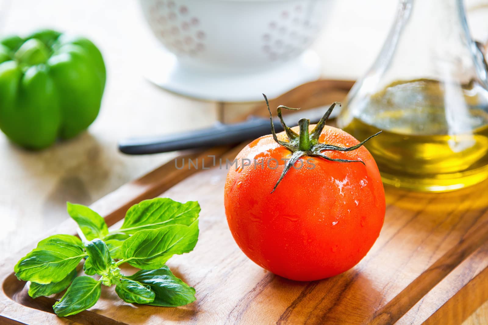 Tomato,Basil and Bell pepper on chopping board by vanillaechoes