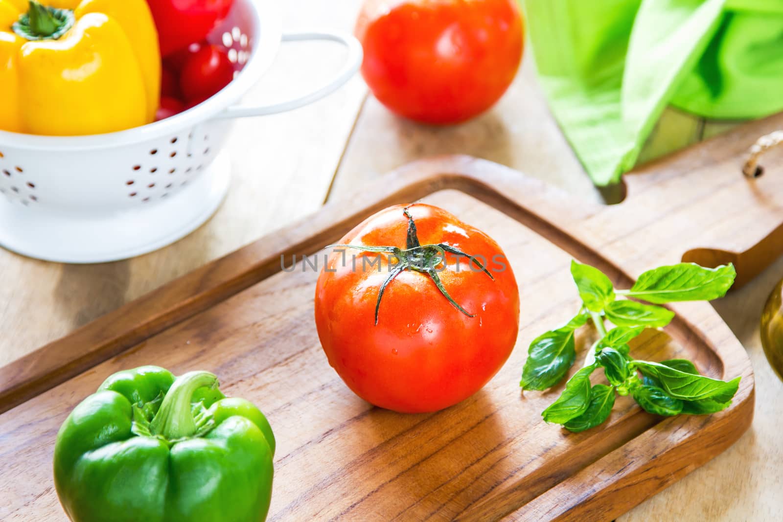 Tomato,Basil and Bell pepper on chopping board by vanillaechoes