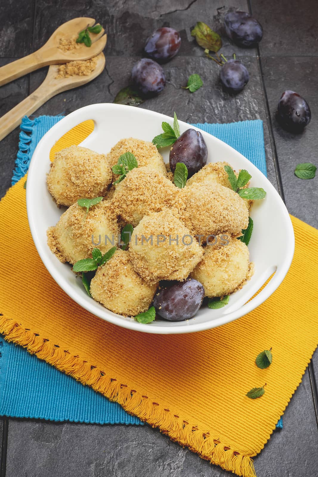 Plum dumplings covered with breadcrumb and sprinkled with sugar by Slast20