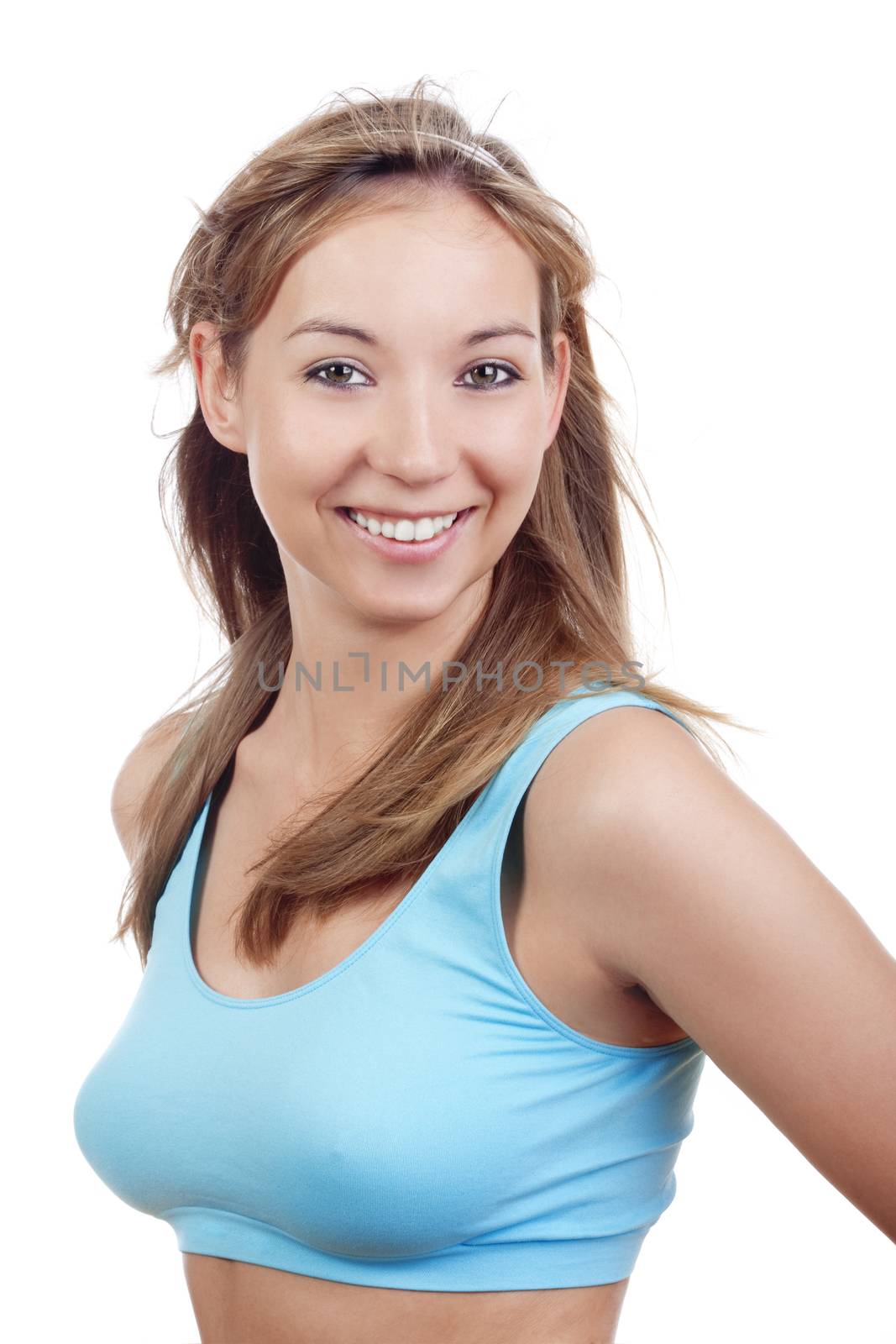 young woman in sports bra smiling - isolated on white