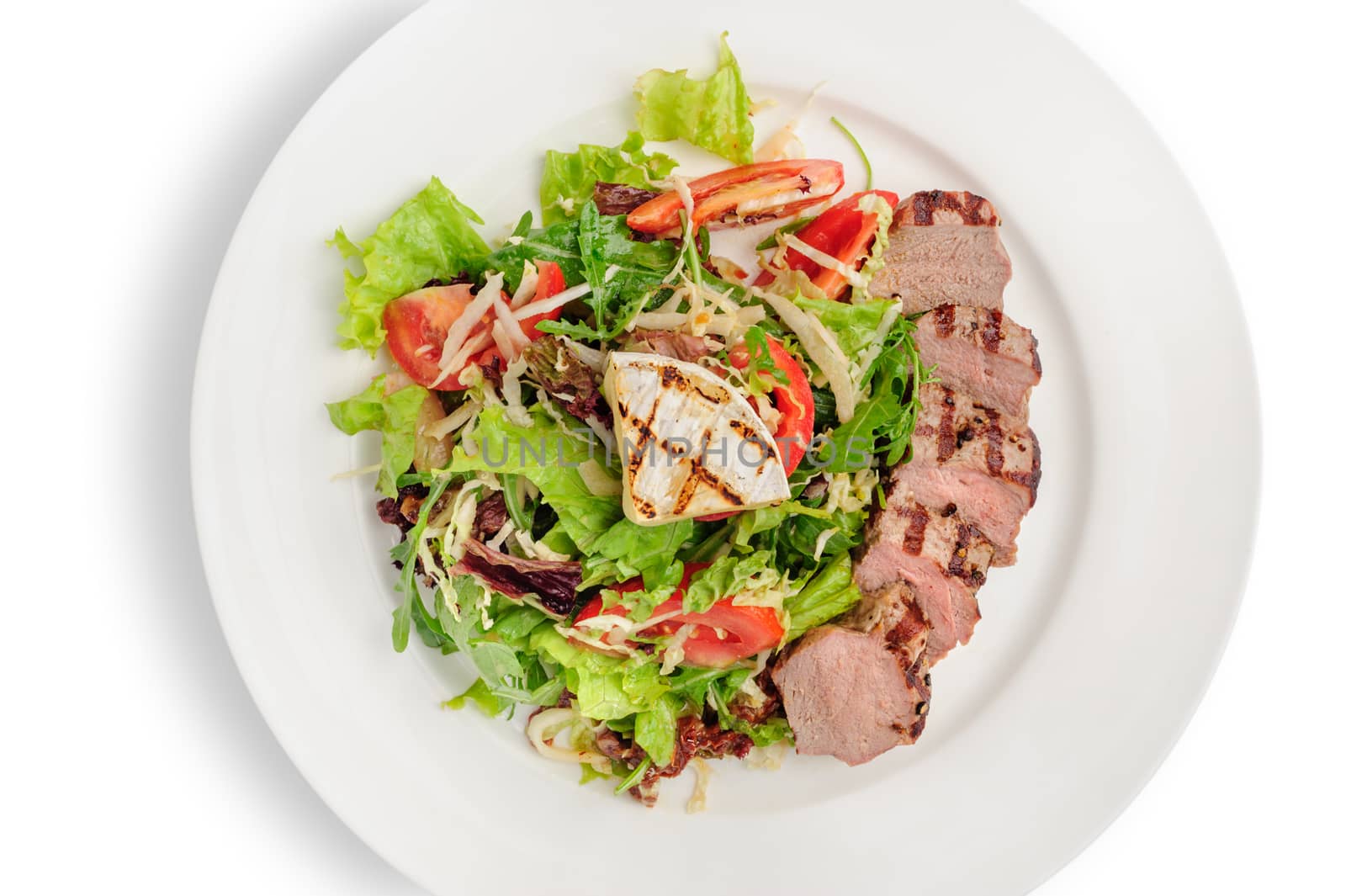 Top view grill roasted veal meat with fresh vegetable salad