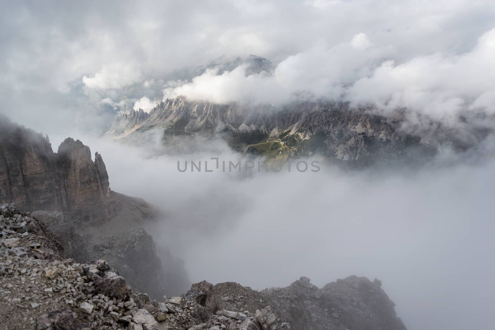 Italian Alps, View of Val Gardena from the top of the mountain between the clouds by enrico.lapponi