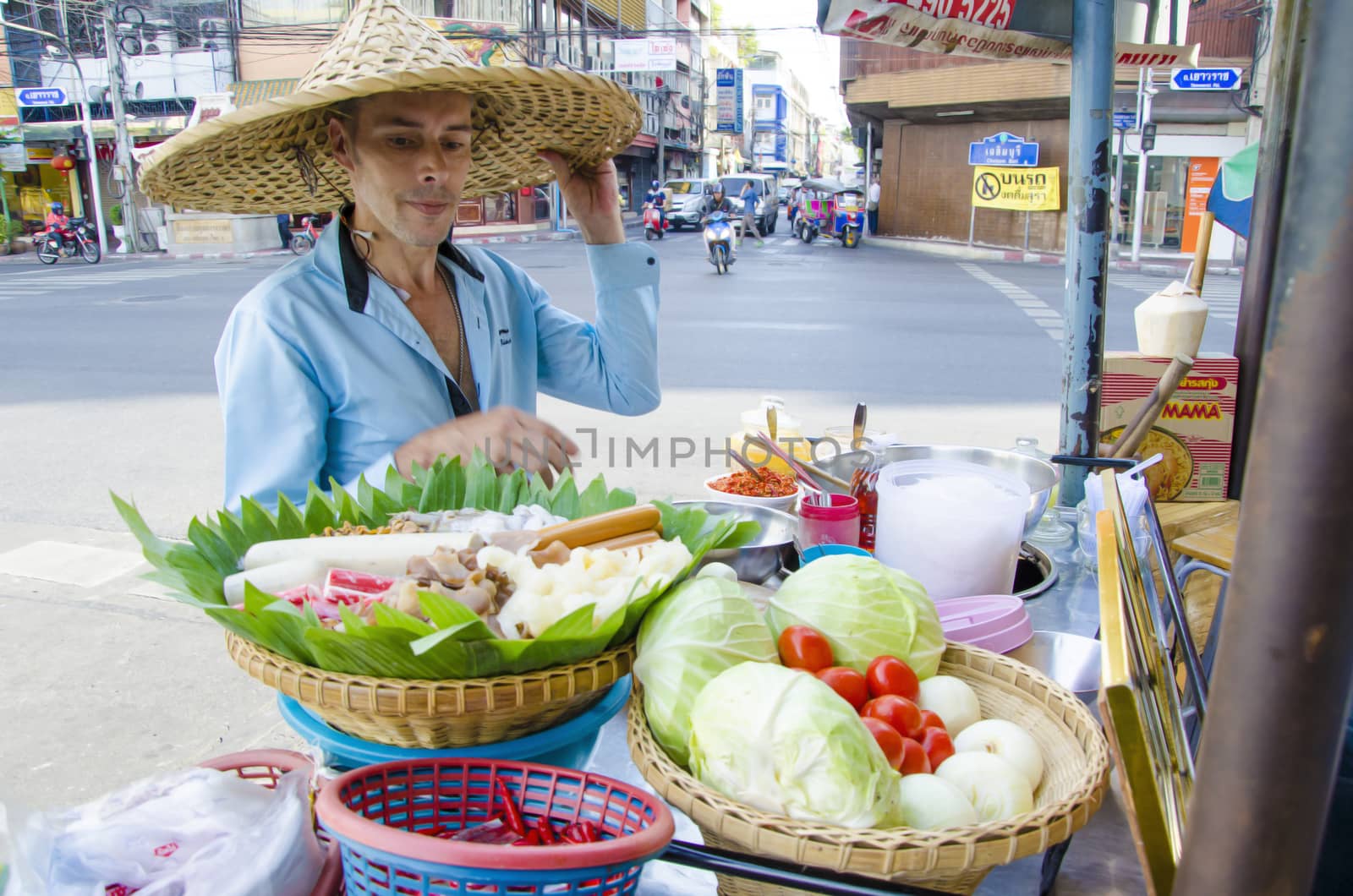 thai salad seller at Yaowarat Road bangkok thailandon 6 April by siiixth