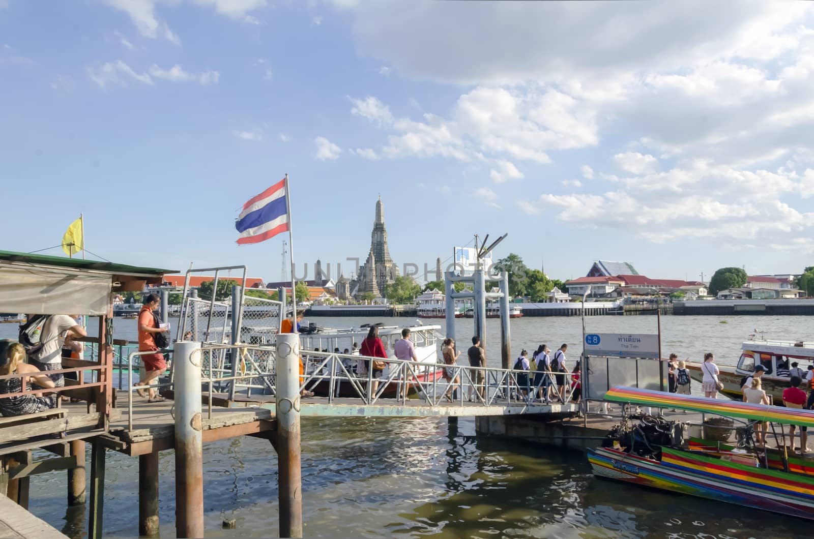 BANGKOK - JULY 3: Group of people aboarding to chao phraya ferry boat, Chao Phraya is a major river in Thailand, low alluvial plain forming the centre of the country. July 3, 2014 in Bangkok,Thailand