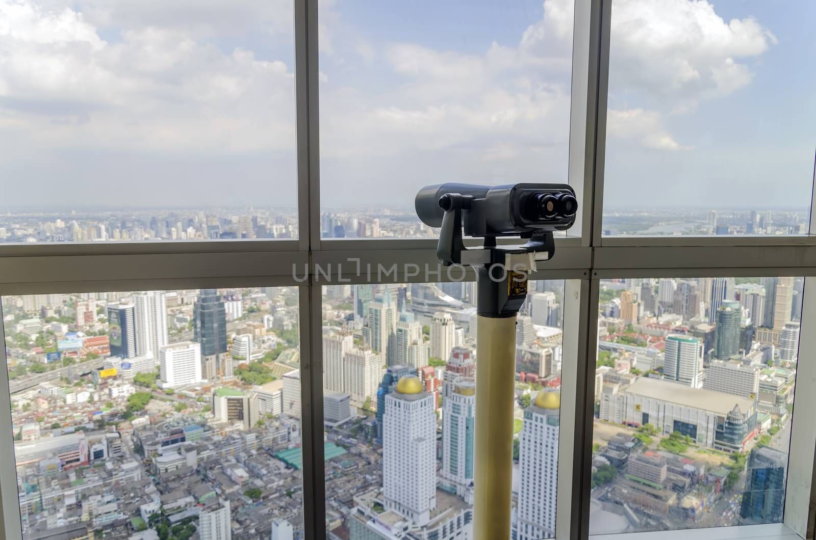 bangkok view and telescope from Baiyoke Tower II on 3 July 2014 BANGKOK - July 3: Baiyoke Tower II is the tallest building in Thailand with 328.4 m. july 3, 2014 in Bangkok, Thailand