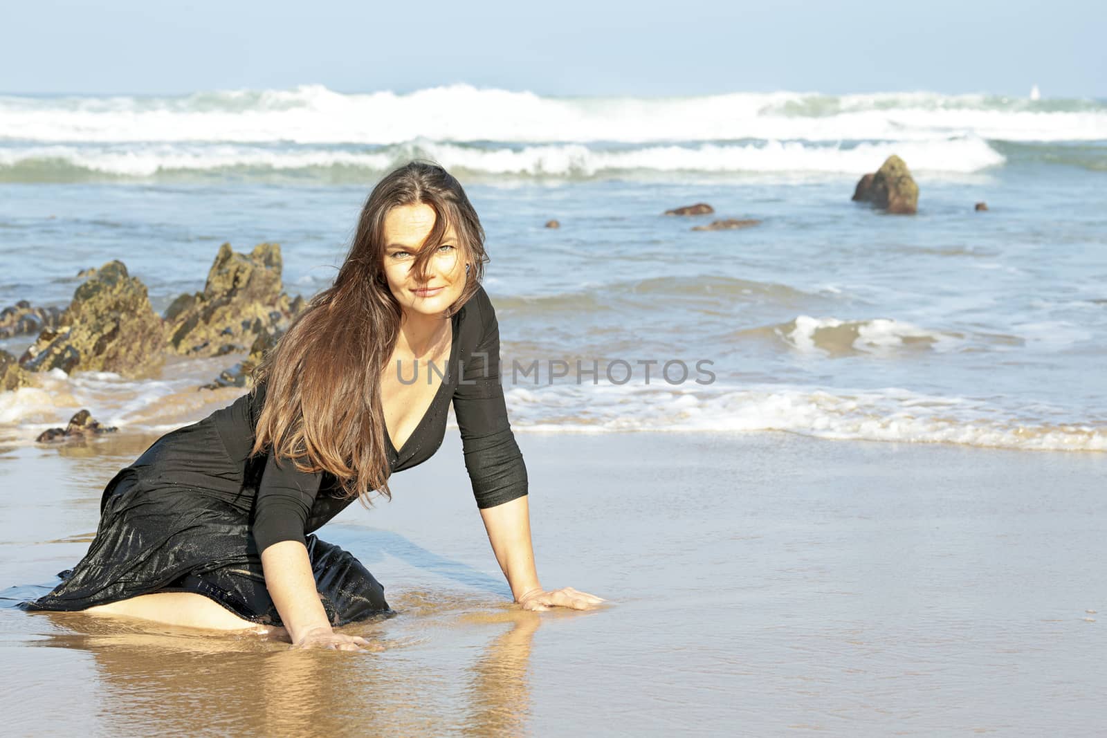Beautiful woman in the water from the ocean by devy