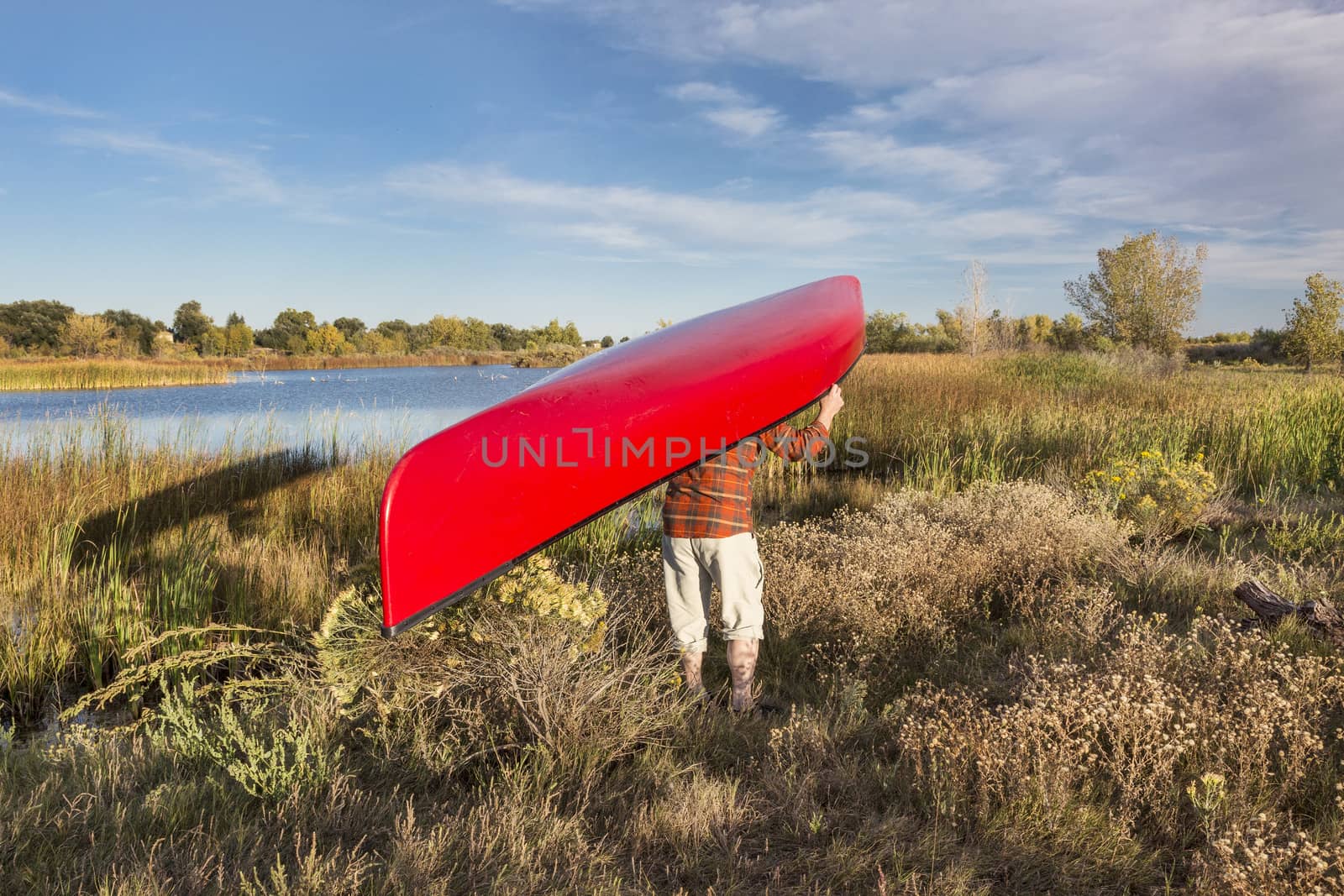 portaging canoe between lakes, Riverbend Ponds Natural Area, Fort Collins, Colorado