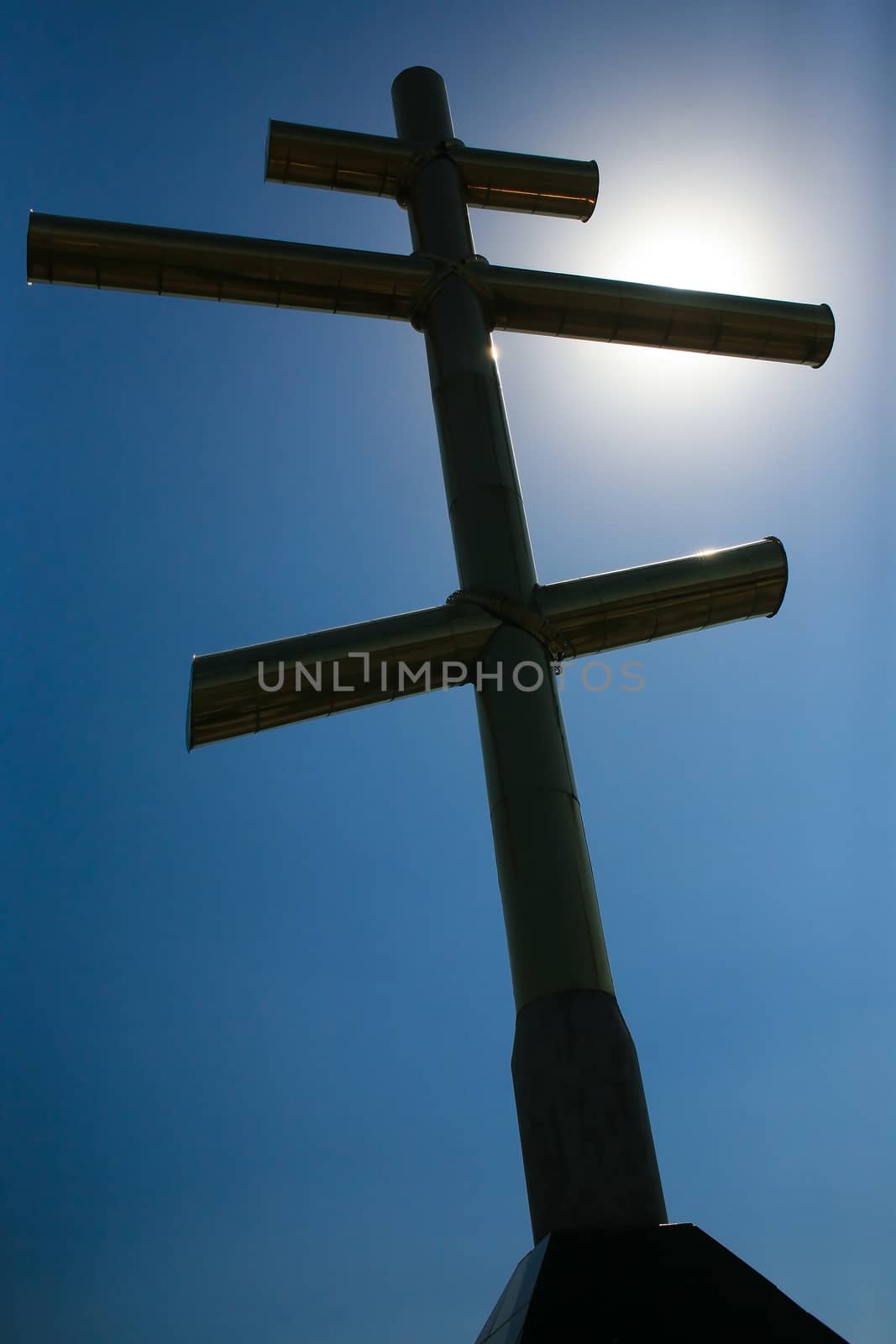 Metal cross in the solar sky by yurii_bizgaimer