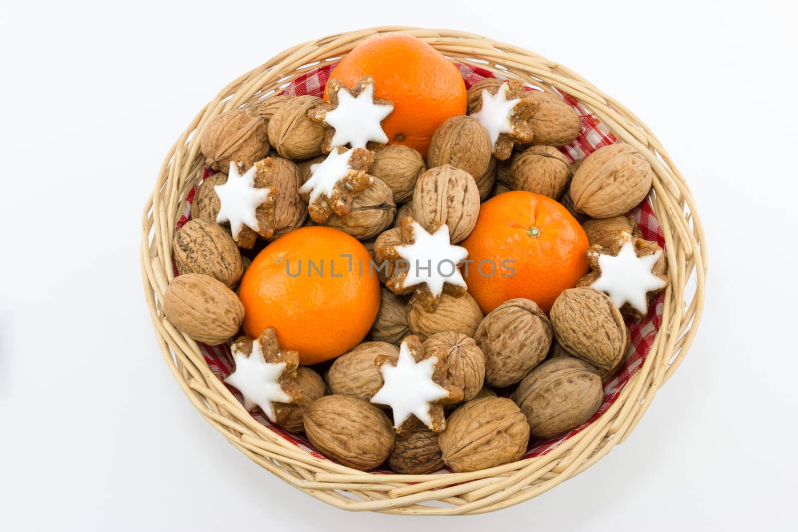 Basket with Walnuts, Tangerines and Cinnamon Stars by MarkDw