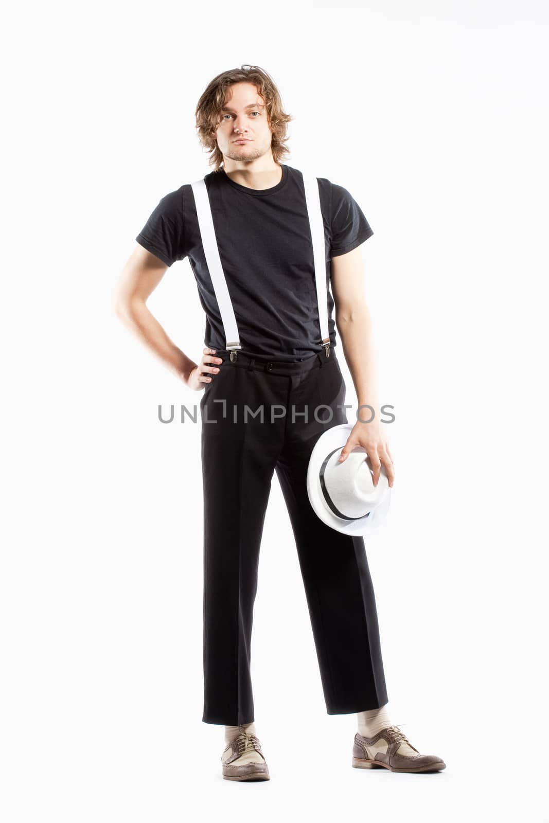 Young Man with Brown Hair Holding a White Hat by courtyardpix