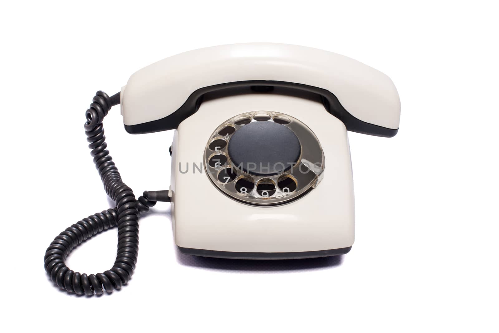 Old disk phone on white background