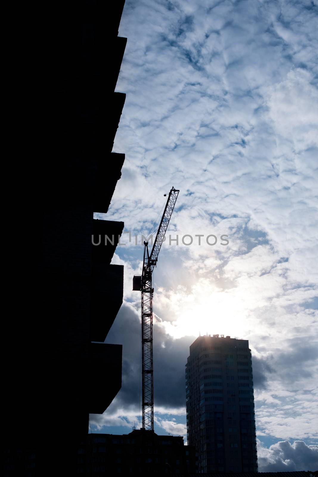 Building site and cranes on sunset