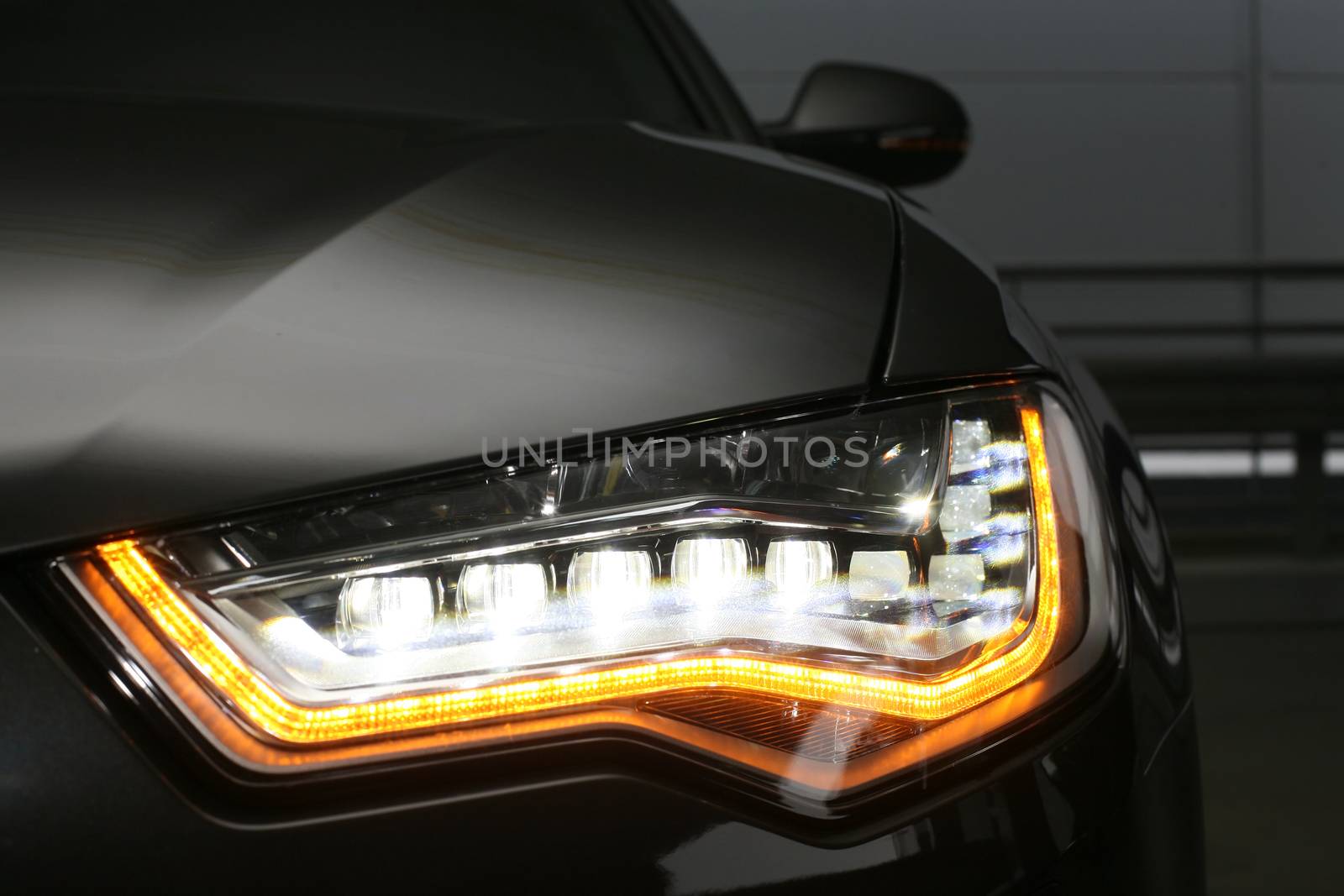 headlight of prestigious car close up by yurii_bizgaimer